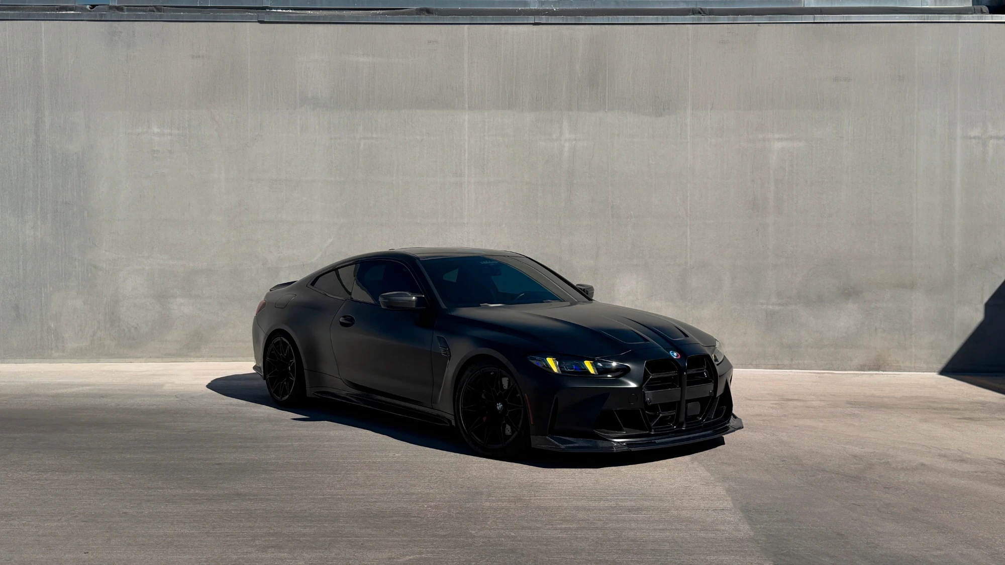 Black BMW M4 coupe with window tint, Phoenix mobile tinting
