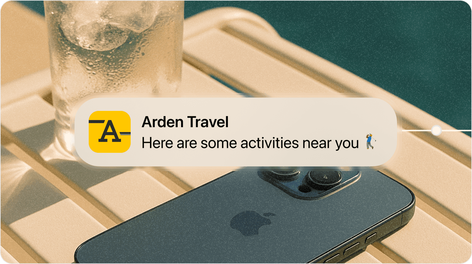 Mobile phone displaying Arden Travel AI notification for nearby activities recommendation