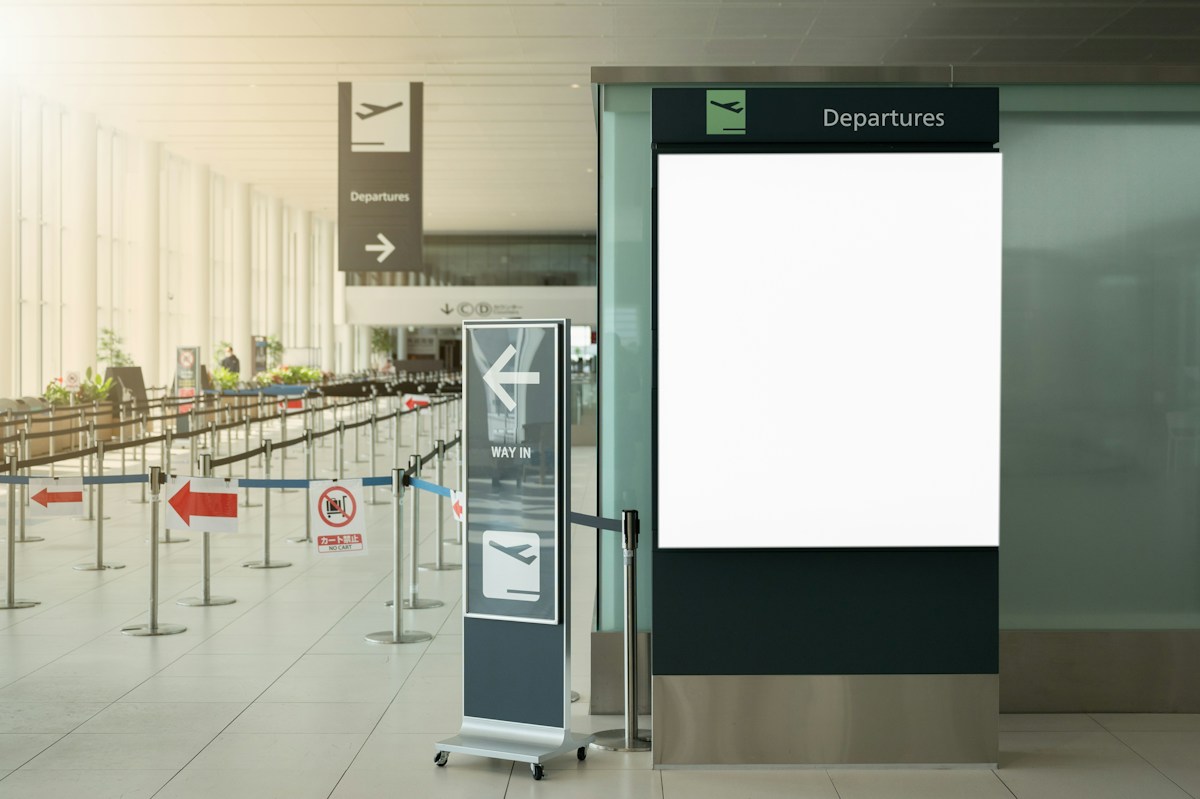 Departures signage at an airport terminal