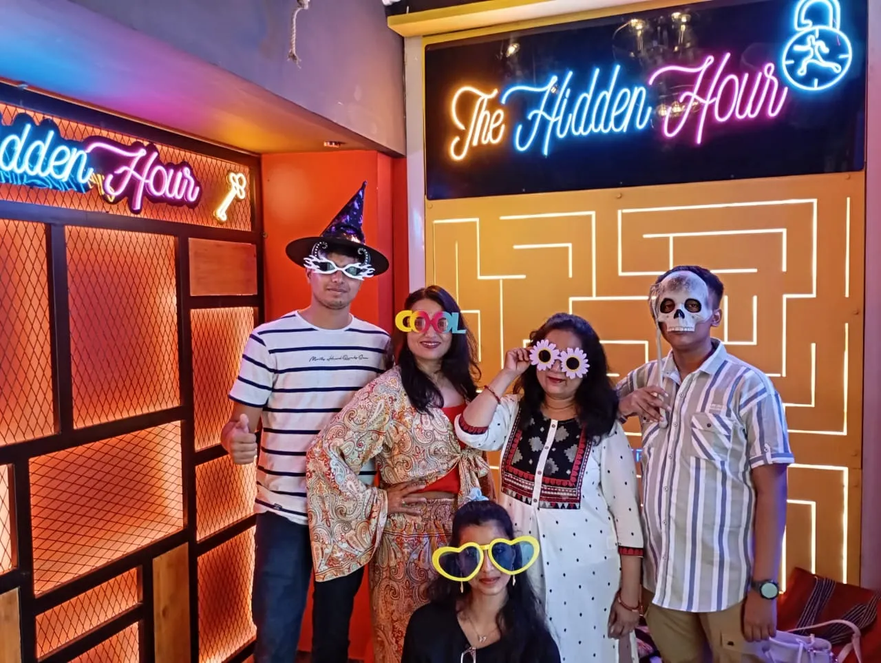 Corporate team sharing feedback after a team-building game at Hidden Hour