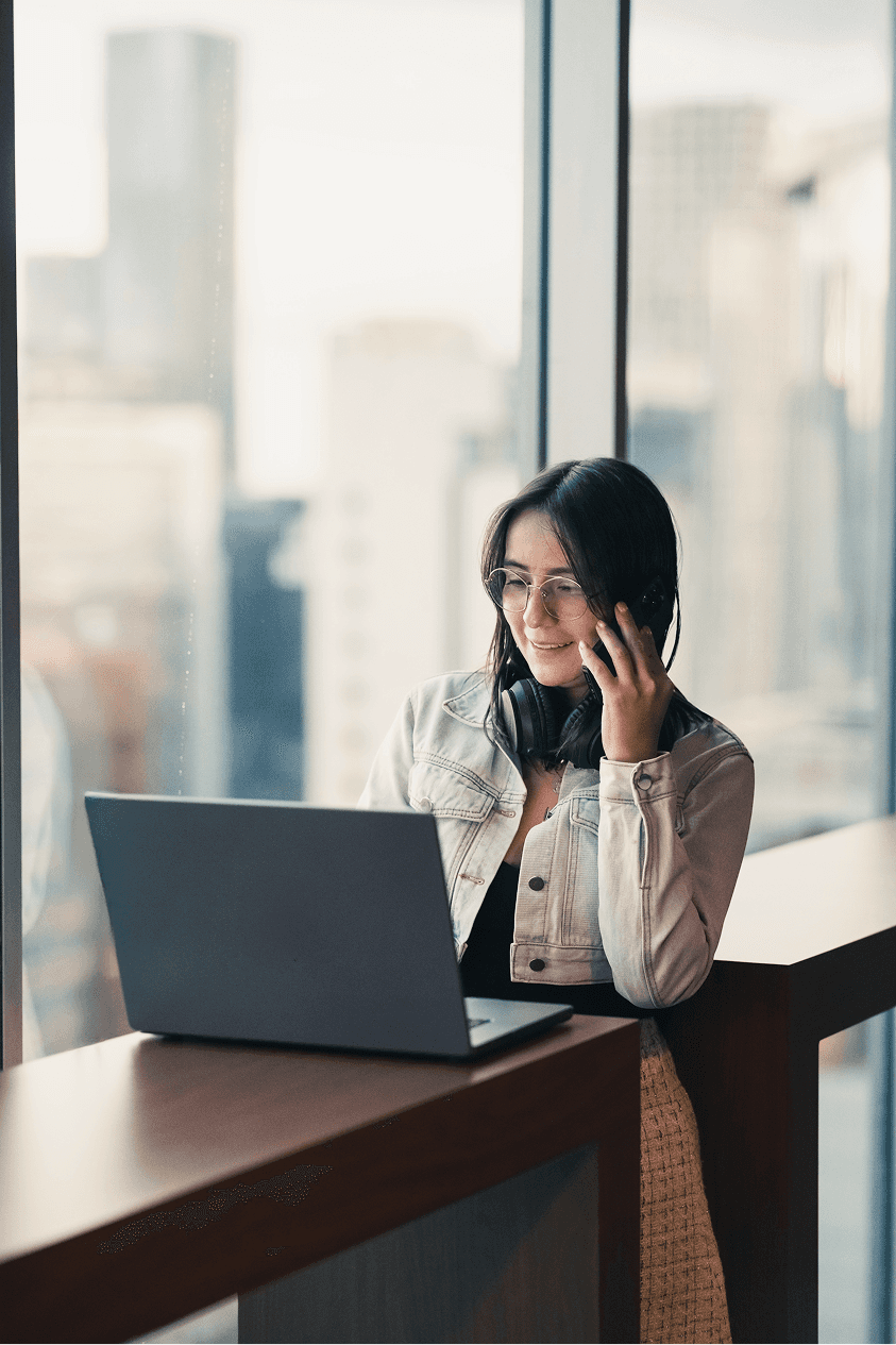 Man and woman discussing tablet outside office building