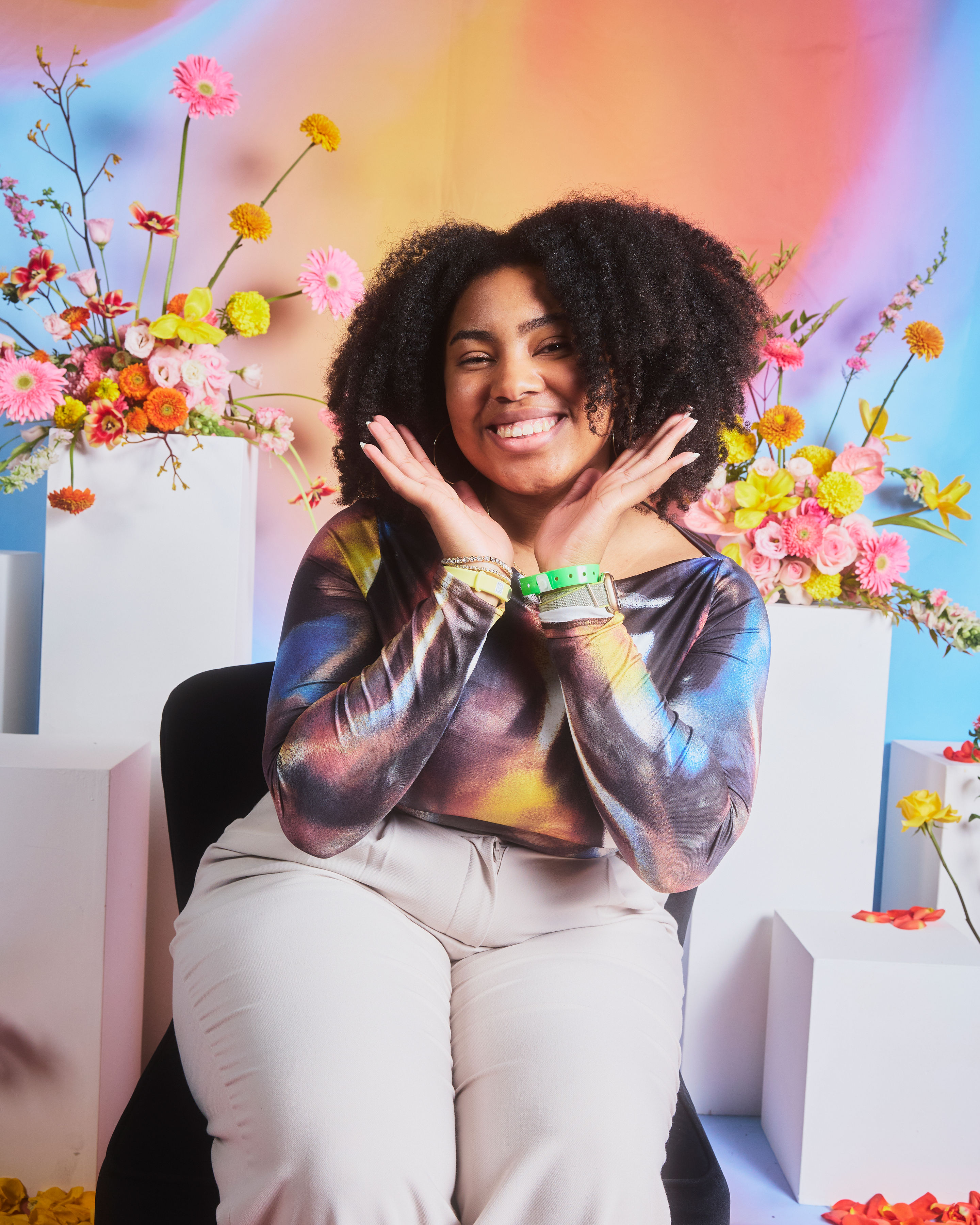 Close-up of a yellow tennis ball sitting on a green court, positioned near the white center line.