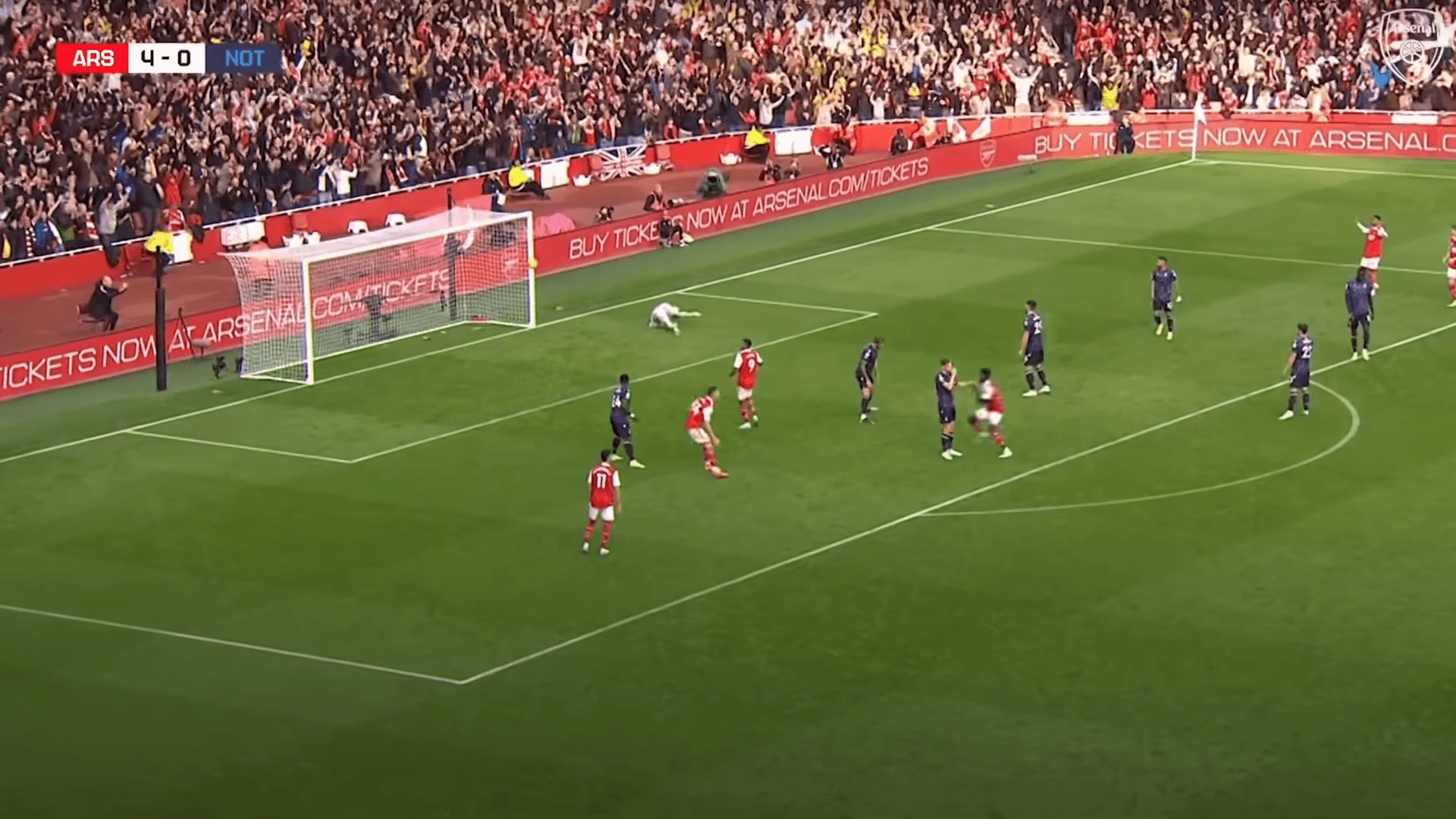 Arsenal FC playing at a filled stadium