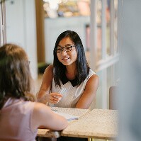 Two women facing each other during a conversation