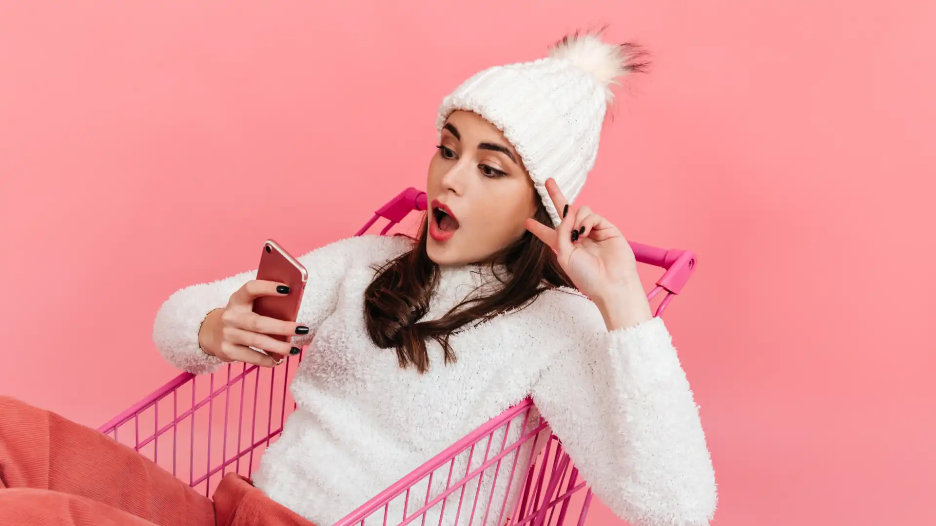 Excited shopper in cart viewing TikTok Shop deals, capturing the viral "TikTok Made Me Buy It" energy.
