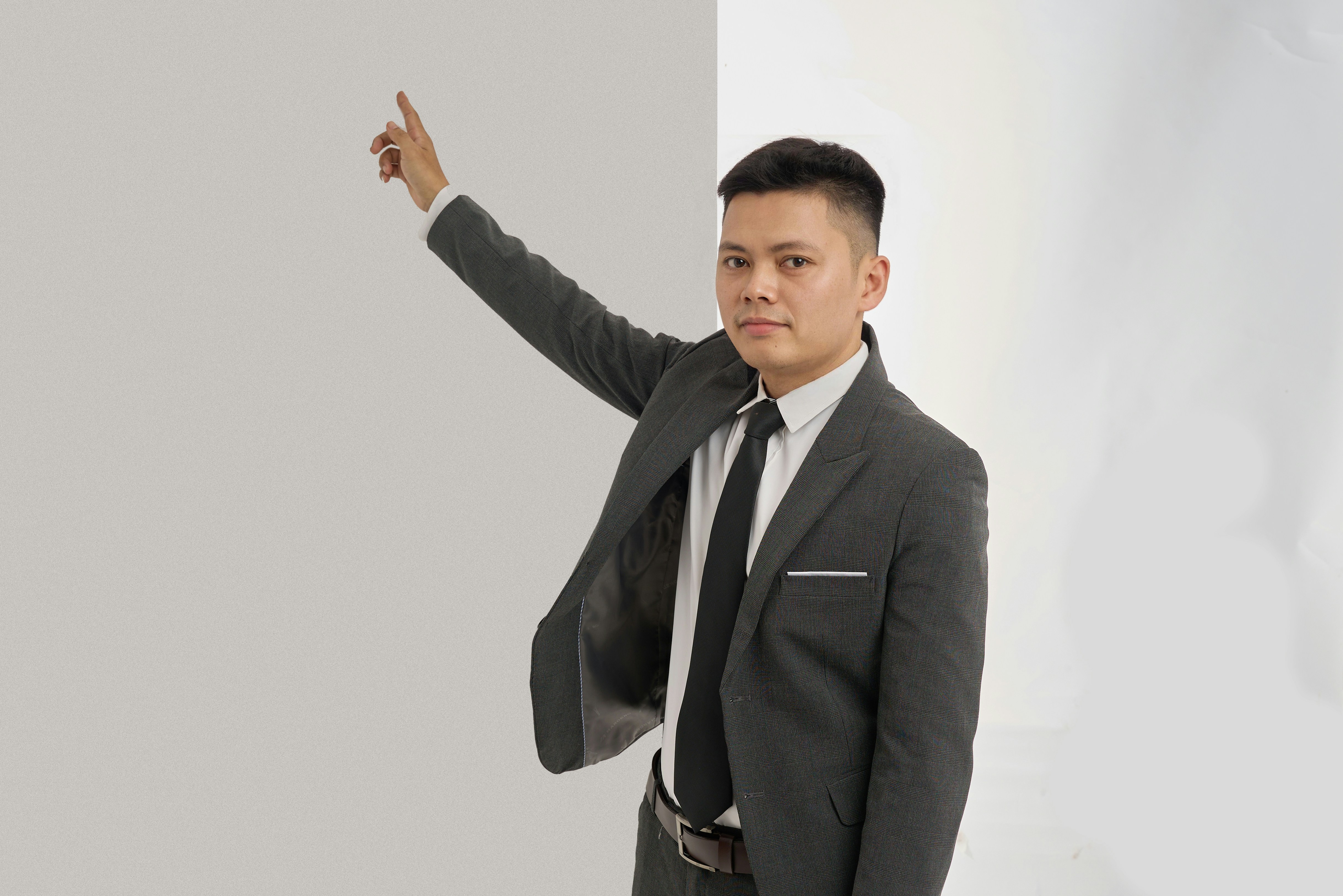 man pointing whiteboard
