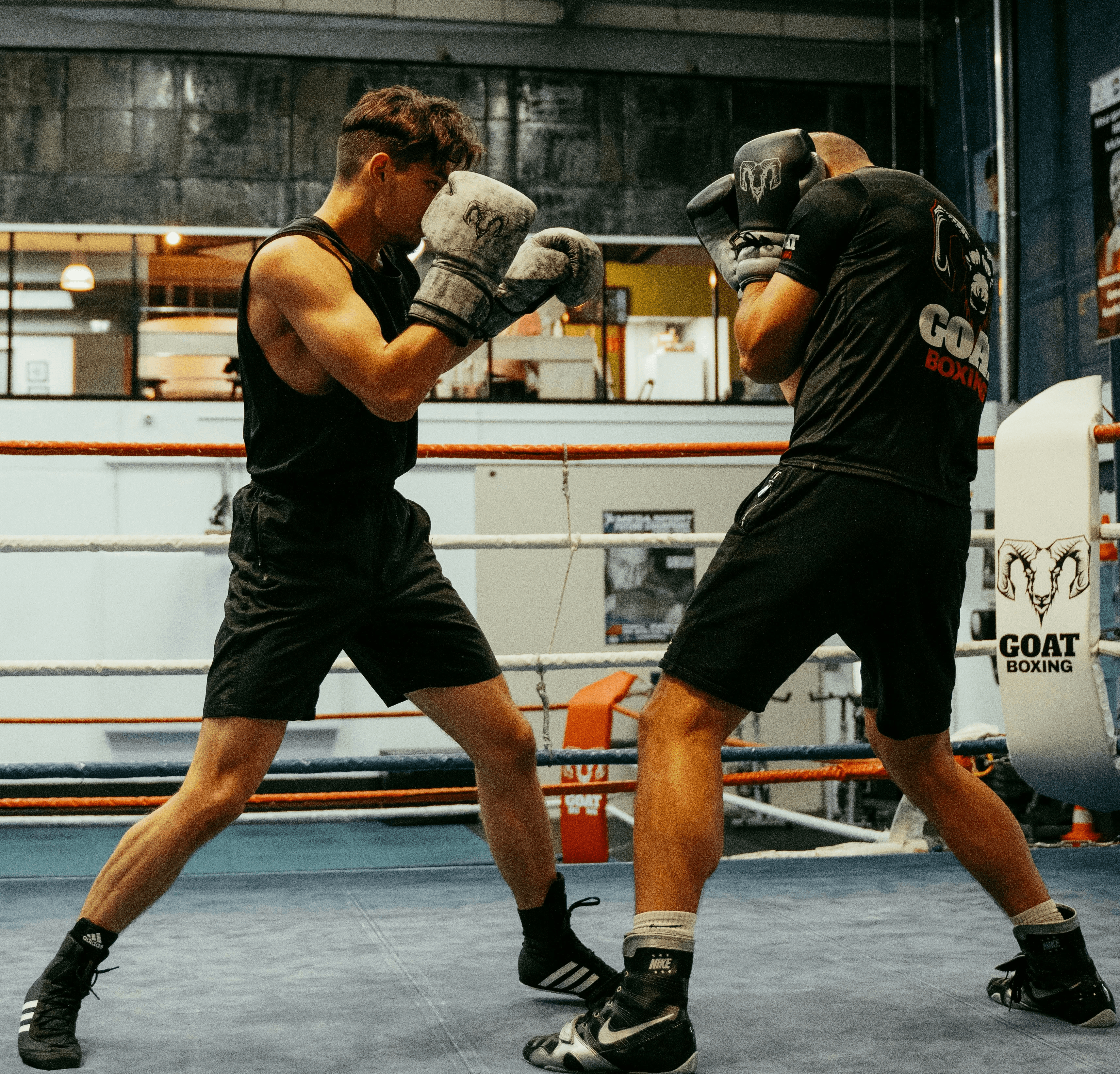 A couple of men standing in a boxing ring