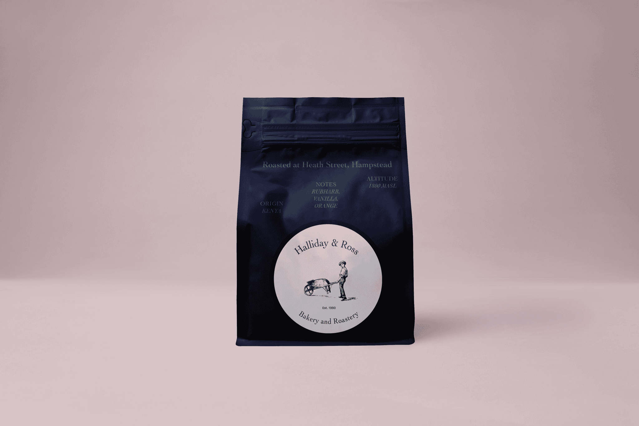 Navy blue coffee bag for Halliday and Ross, with pink background. Modern and stylish packaging displaying logo and information about the coffee beans