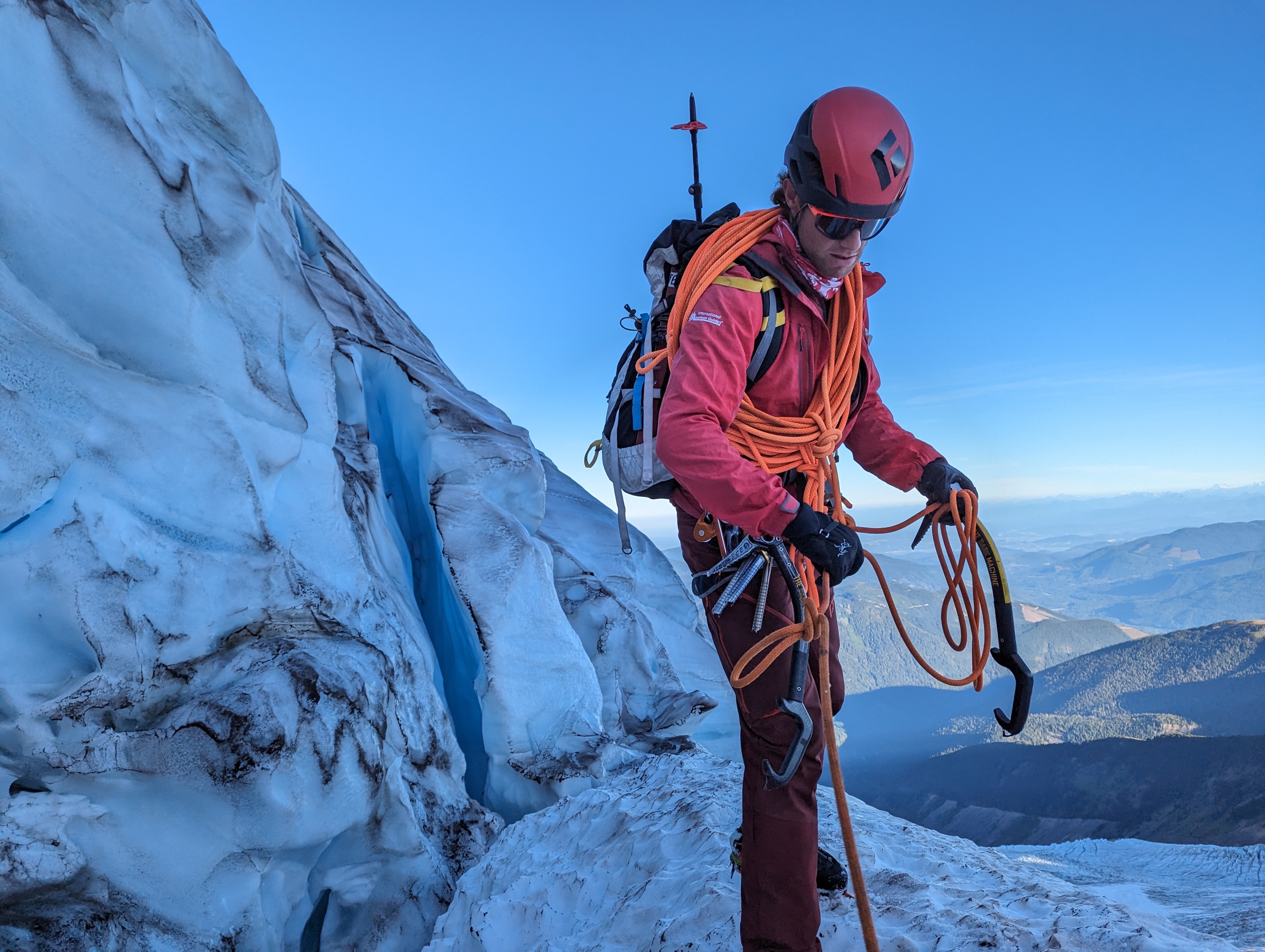 Snow-capped mountain peak behind evergreen trees