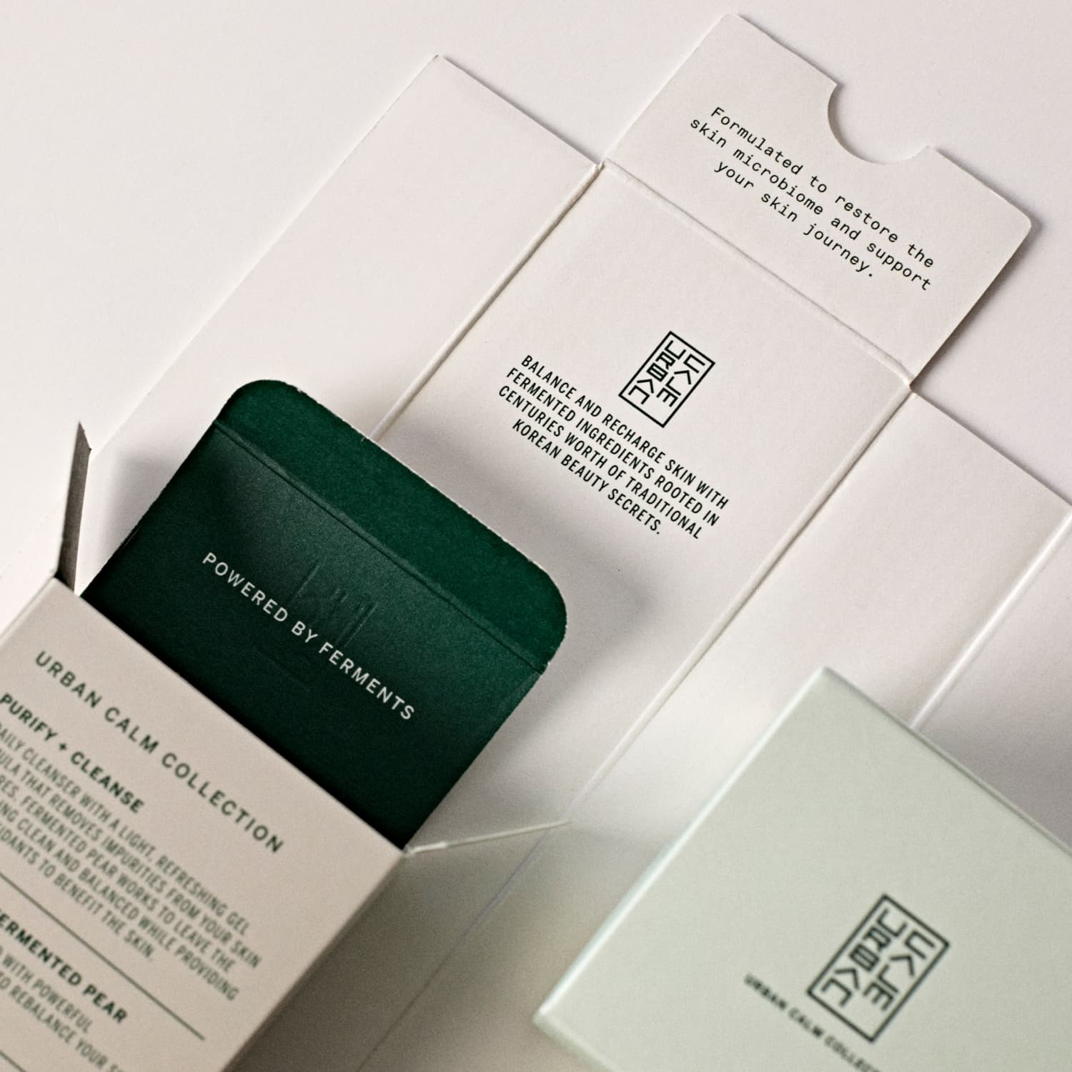 Streetside billboard with flyposters of the Batch.Works brand and illustrations