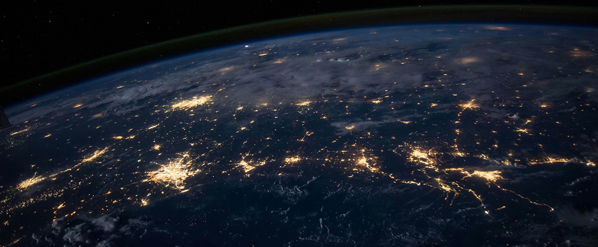 Aerial view from space of the Earth, lit up by human activity