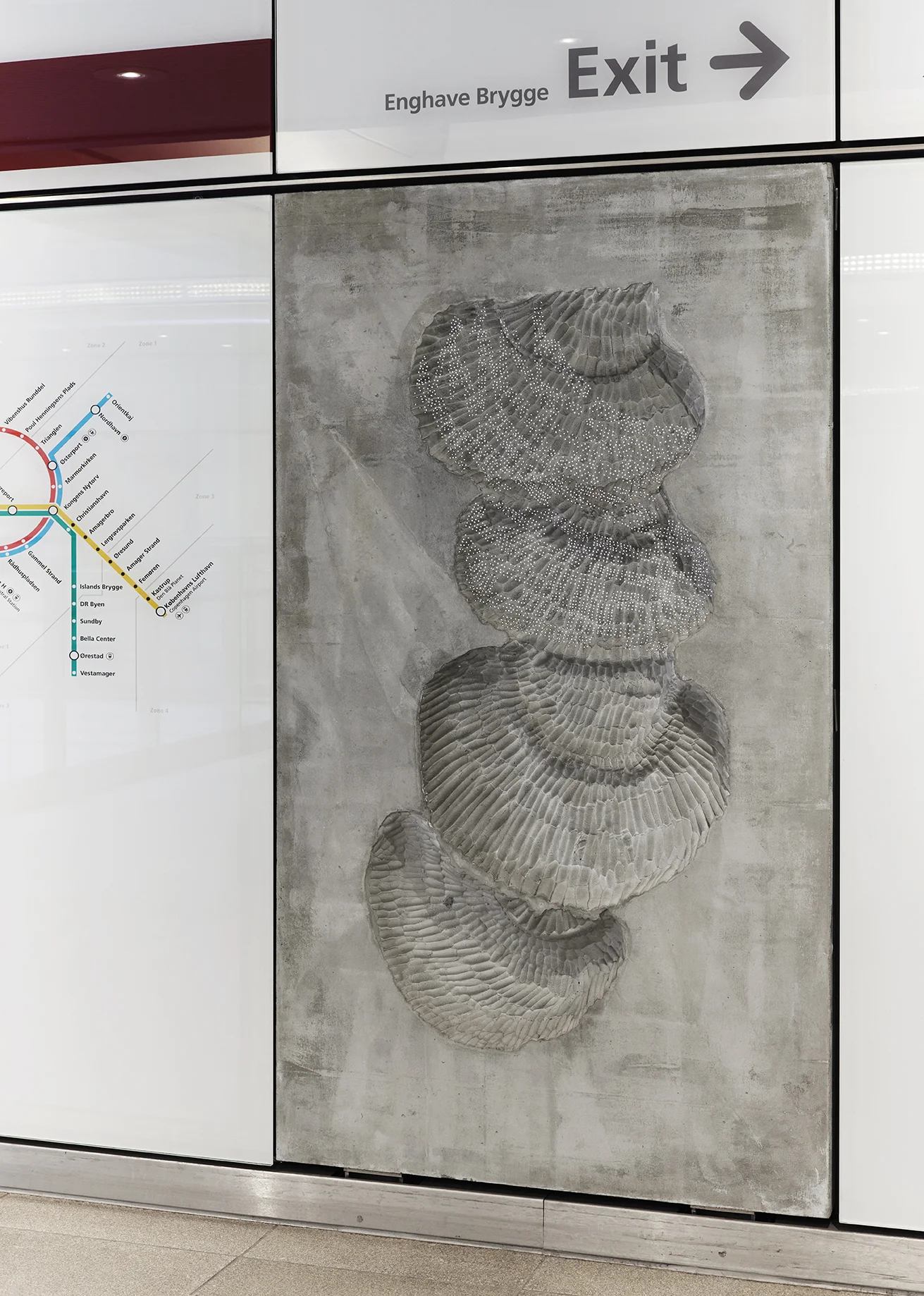 Installation photograph of the public commission work installed at Enghave Brygge Metro, Copenhagen. Concrete reliefs with optic fibers.