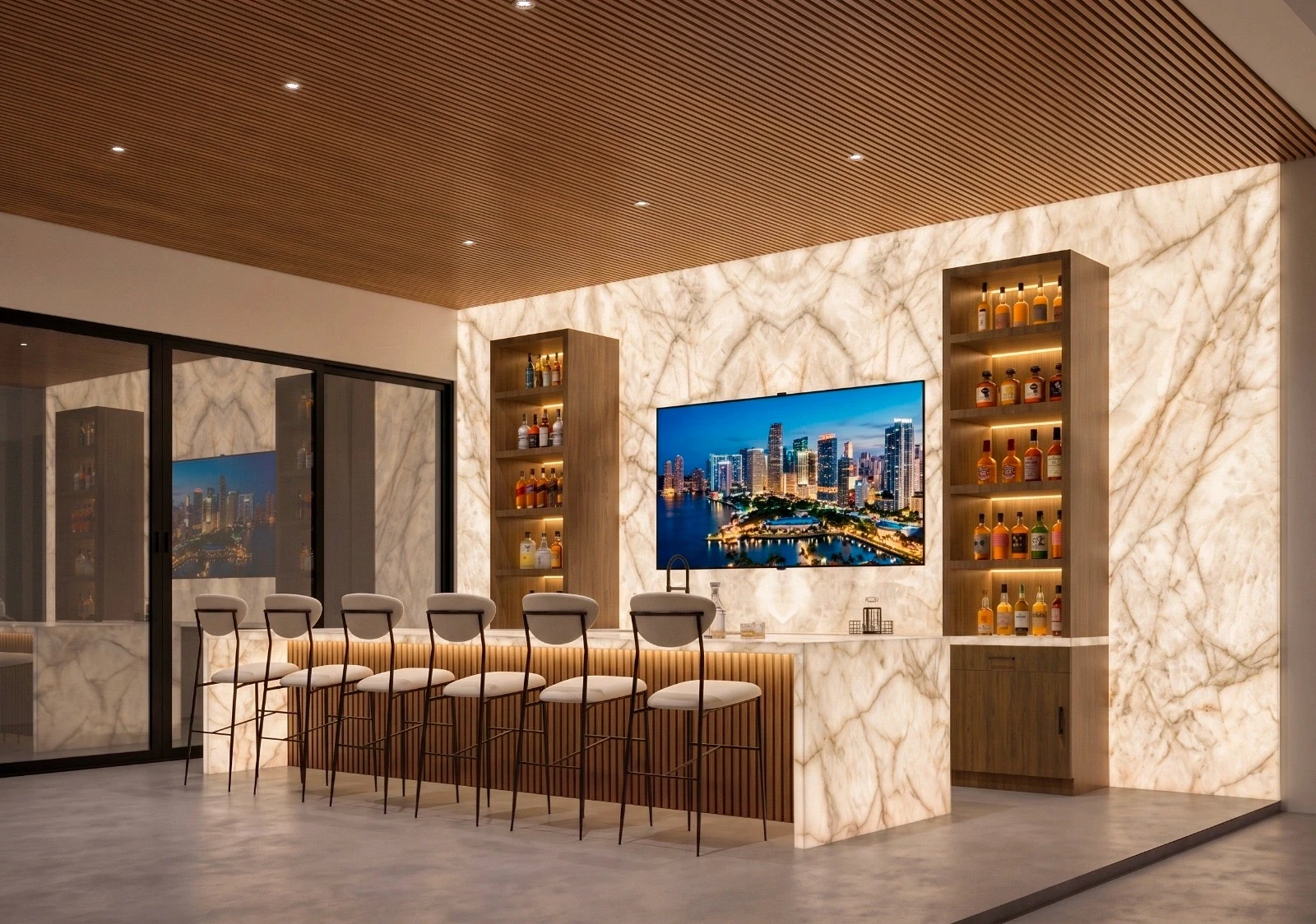 Home bar with a backlit onyx feature wall and matching waterfall bar counter, timber slat ceiling, LED-lit wood liquor shelving flanking a wall-mounted TV showing a city skyline, six cream upholstered bar stools with black metal legs, a fluted wood bar front with warm under-counter lighting, black-framed glass sliding doors, and polished concrete floors.