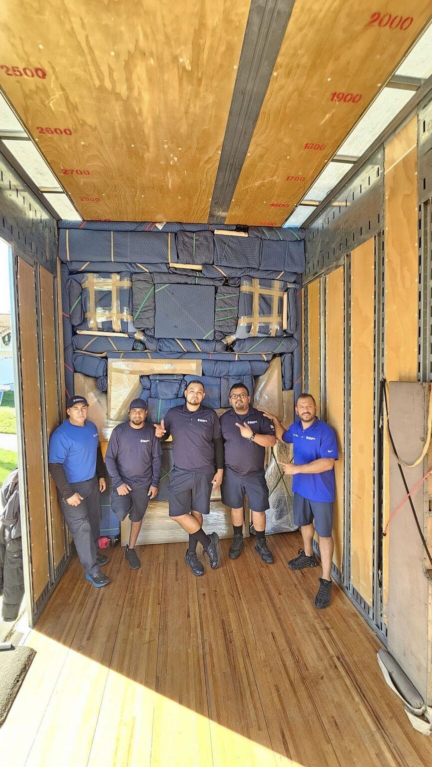 skilled movers labor inside the truck