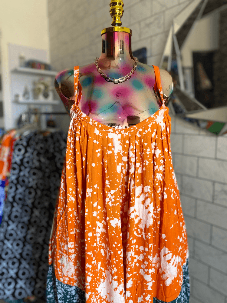 a white shelf with objects on it