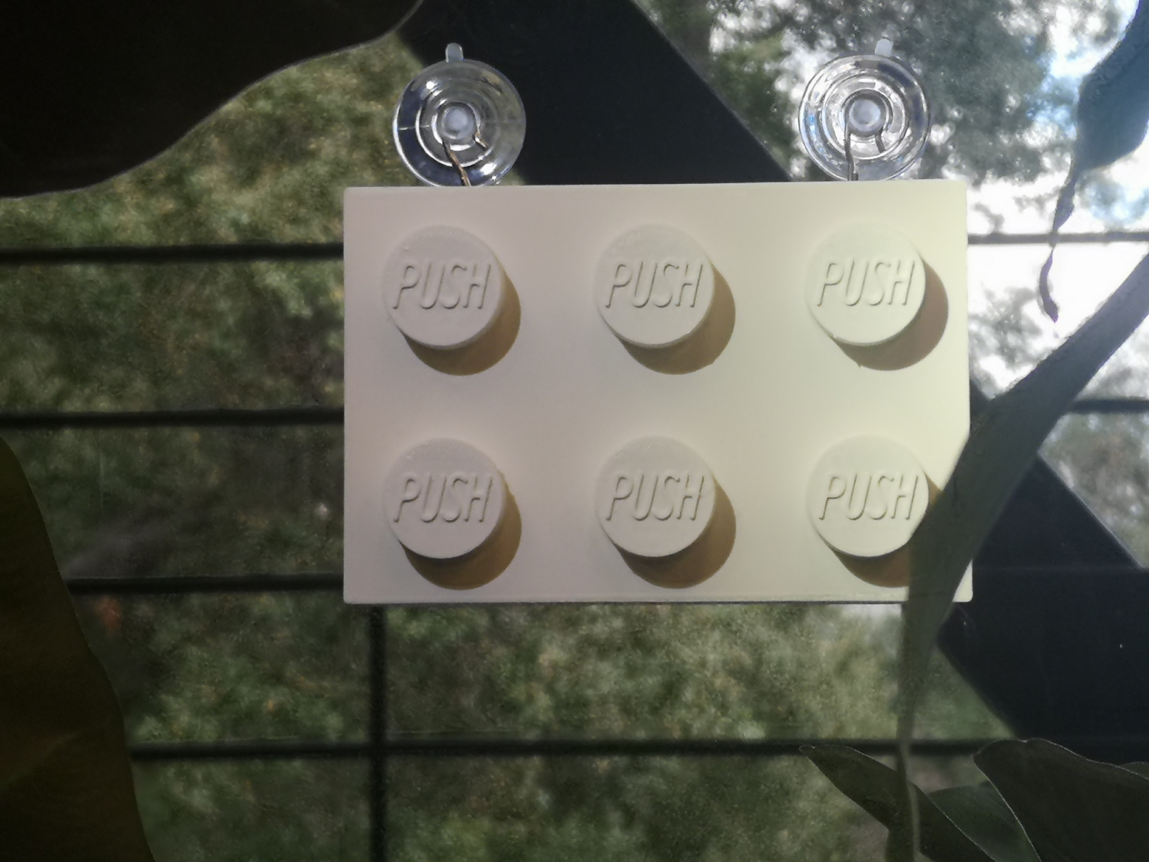 Minimalist lemon product photo with glass cup on pastel yellow background