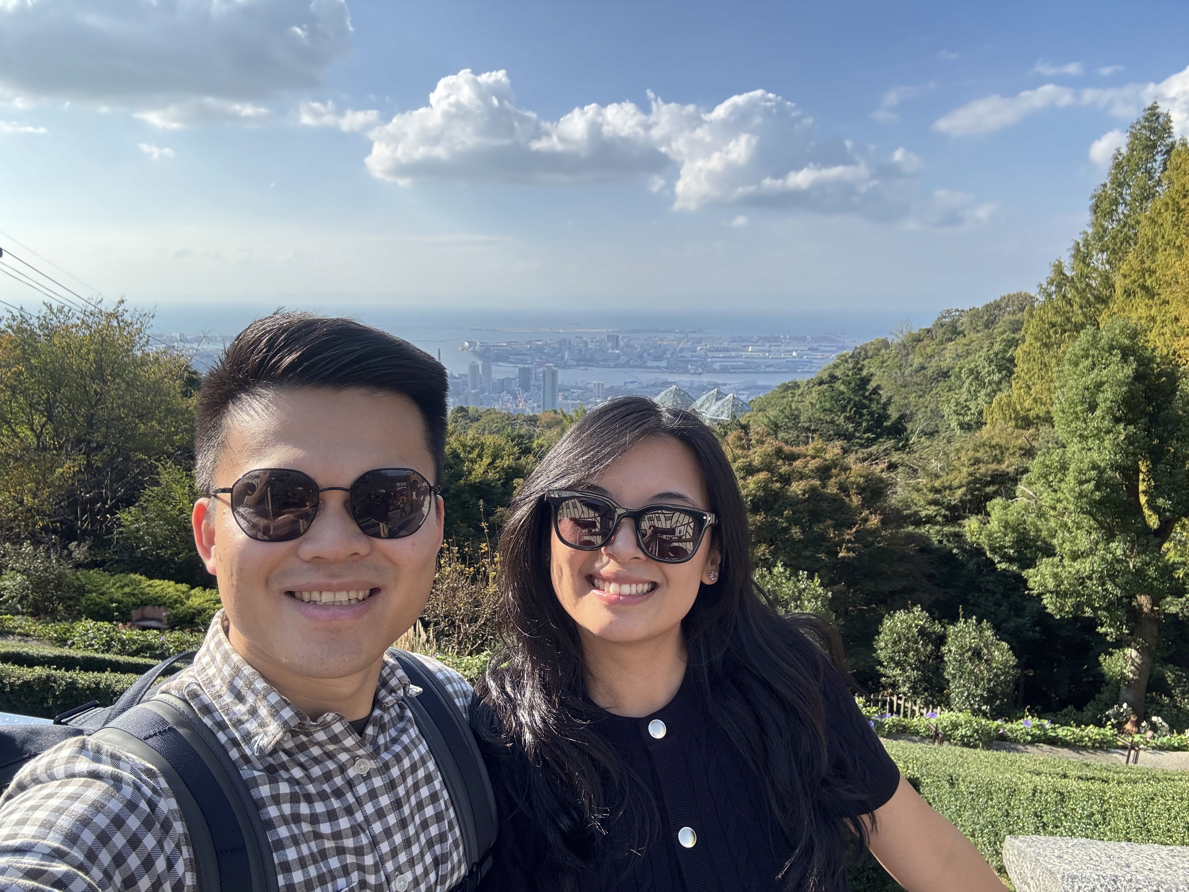 A close-up of two people holding hands, one wearing a denim jacket. The background is softly blurred, suggesting a tender, intimate moment in warm light.