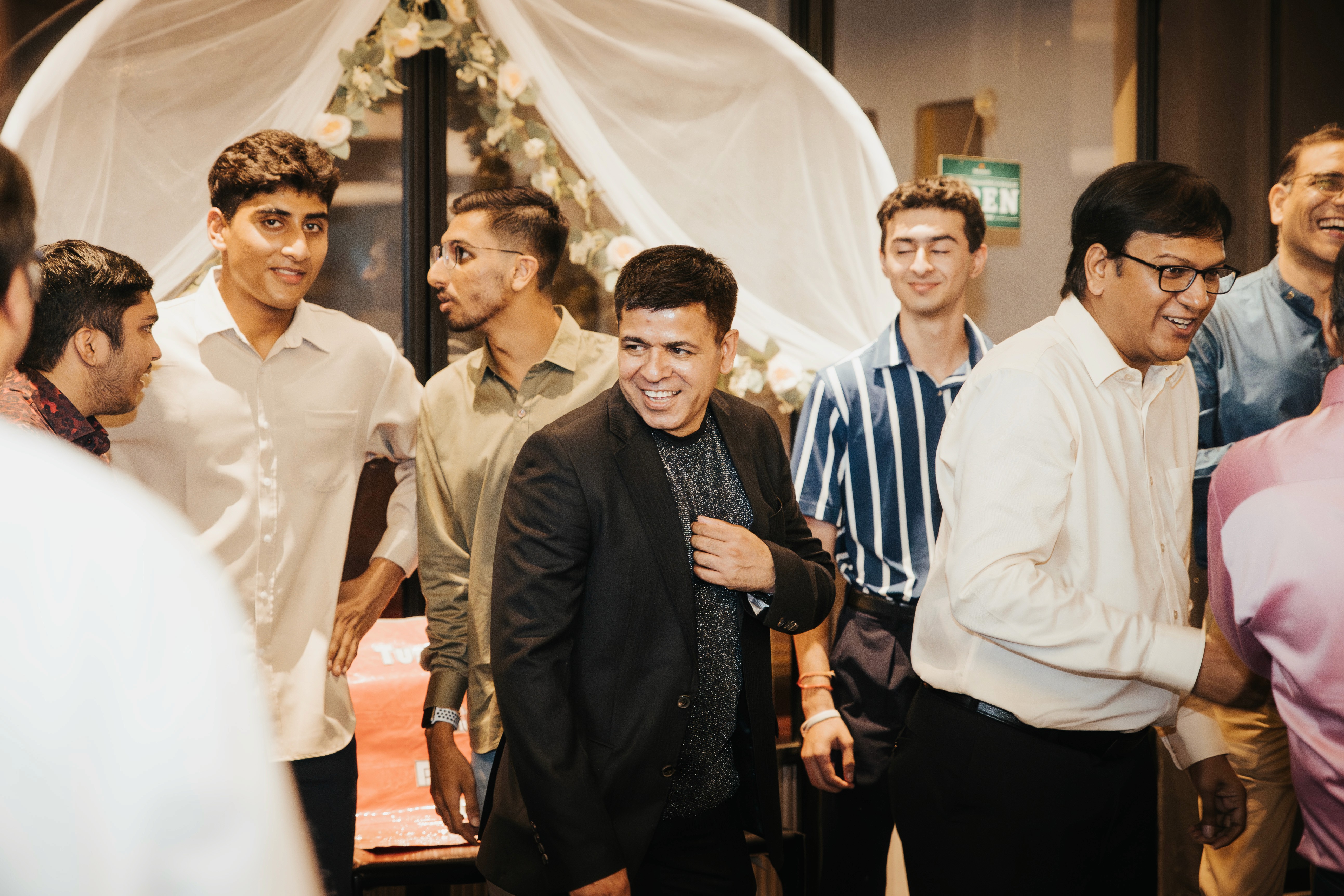 Vibrant energy and celebratory dancing during a festive Indian event.