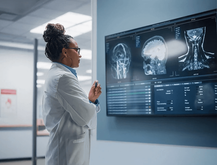 Doctor reviewing medical imaging films for catastrophic injury diagnosis