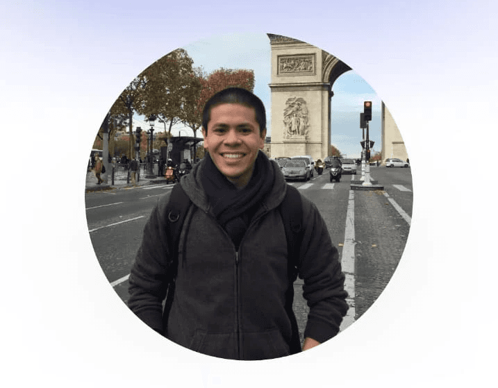 man standing beside wall