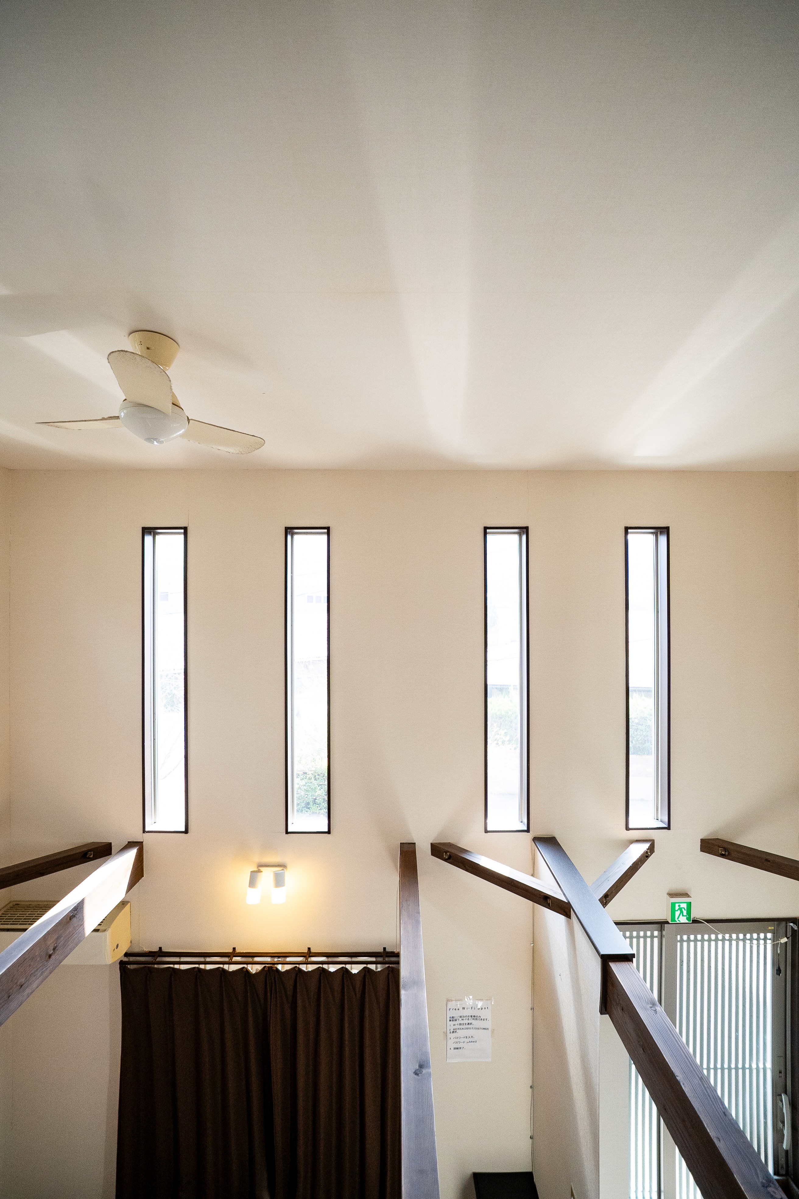 Traditional carpeted stairs ascending with candle-like wall stands and classic interior styling.