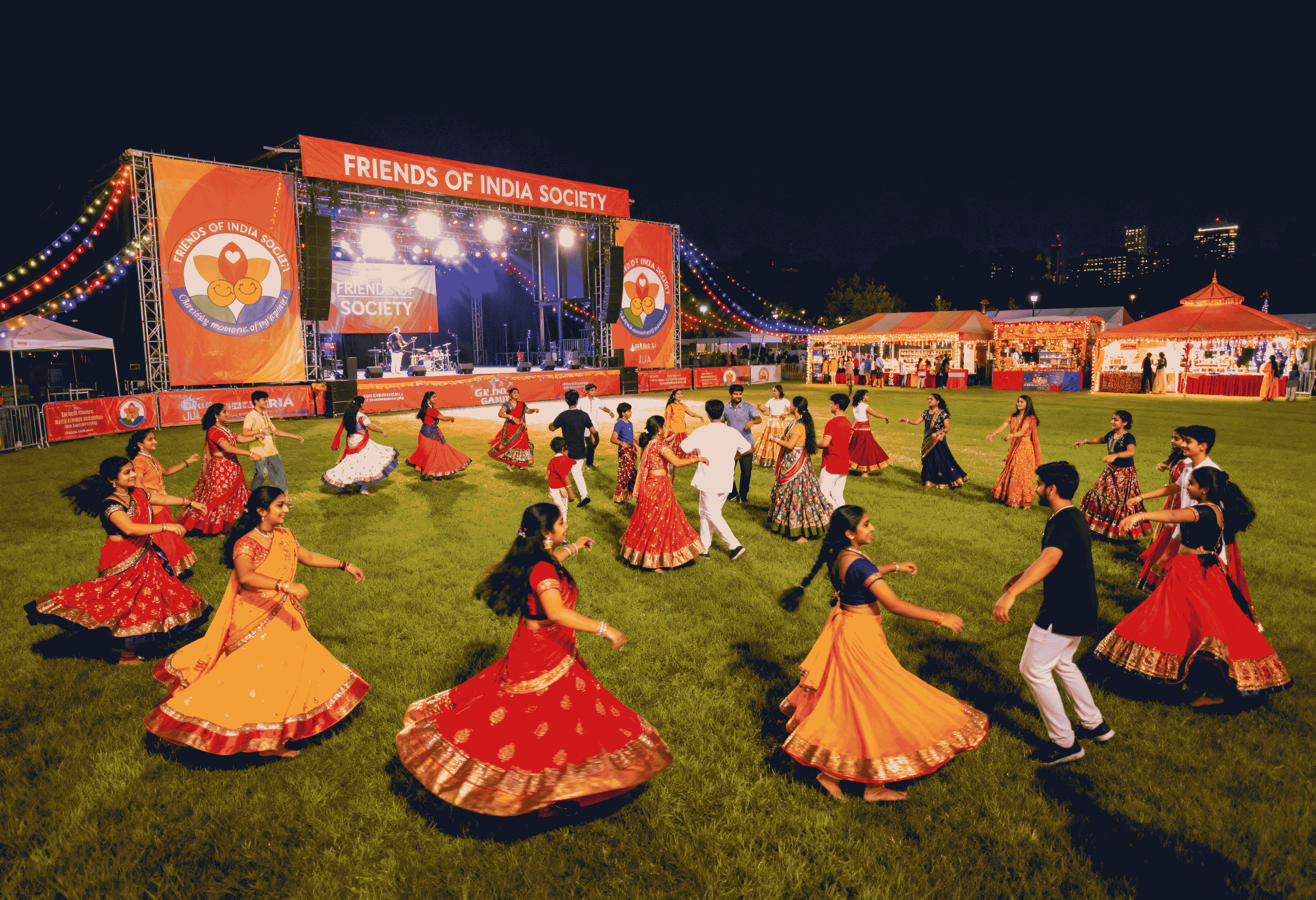 A woman in a teal dress sits in a dimly lit room, focused on her smartphone. A laptop and notepad are on the glass table, suggesting a working environment.
