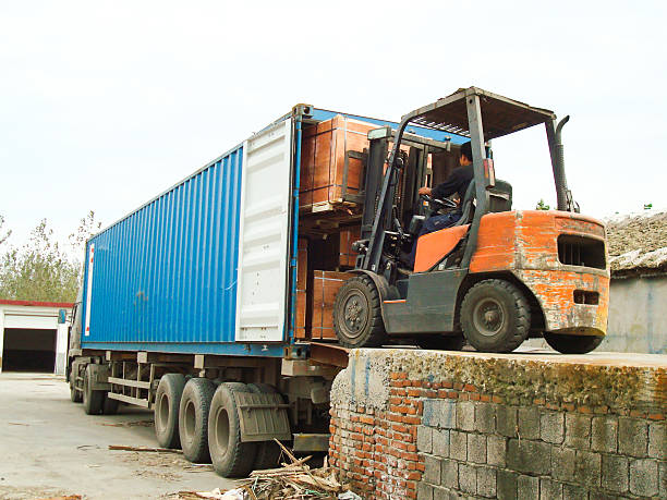image of a forklift laoding the back of a lorry