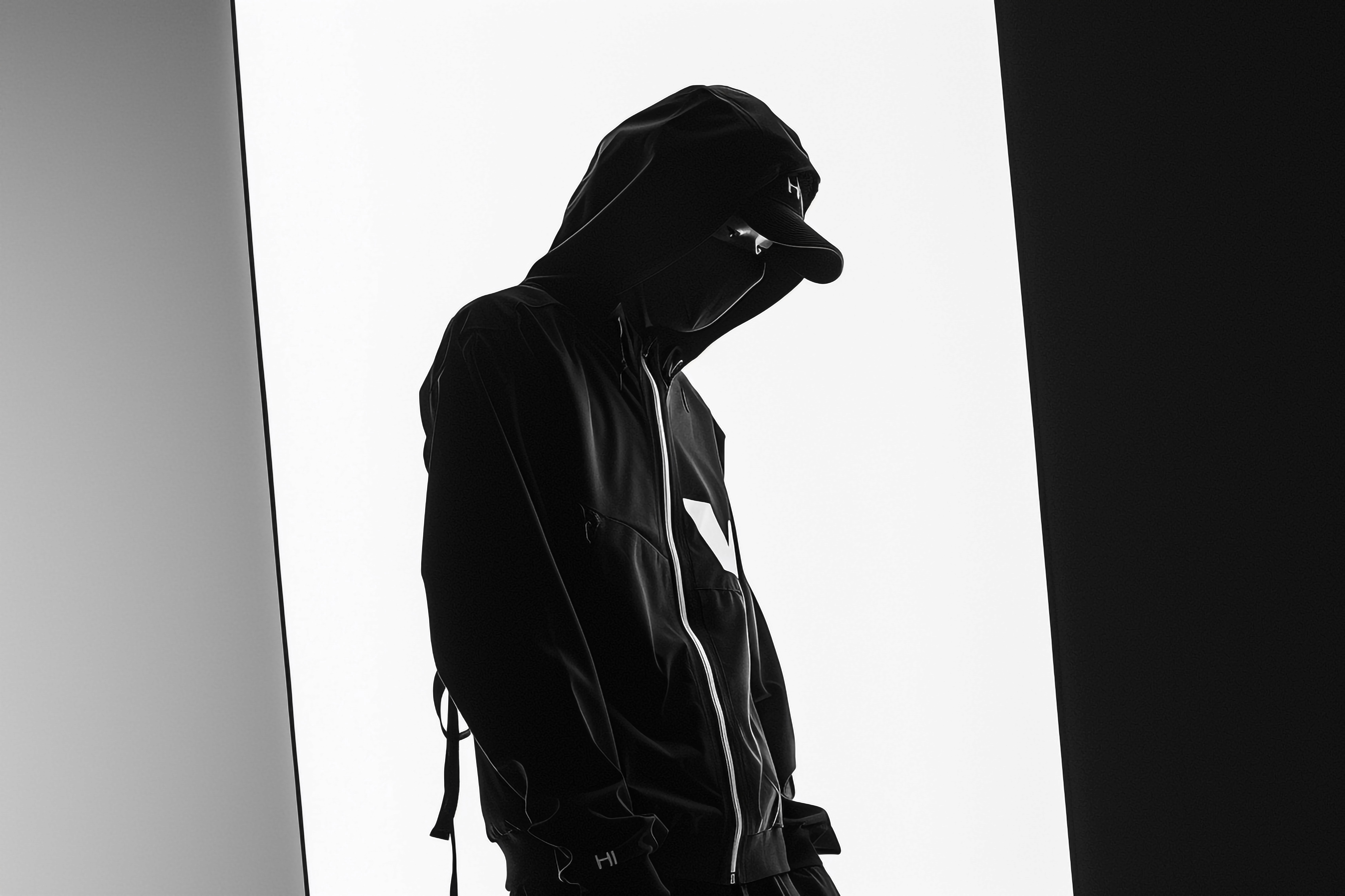 rendy Fashion Model in Cloth Infused Outfit Black and White Lifestyle portrait with Chic Background.