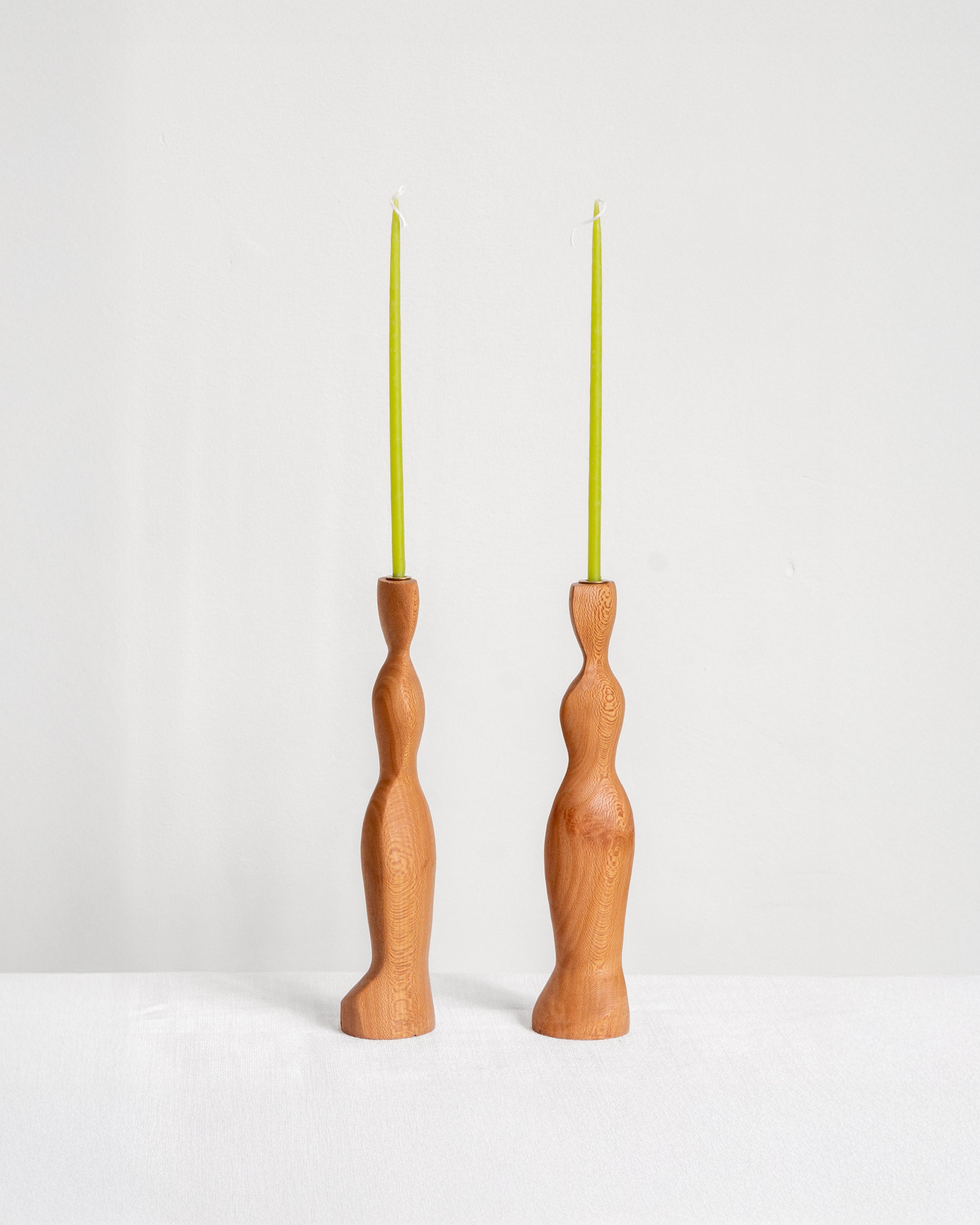 Figura Candlestick holders in London Plane on white background with green candles