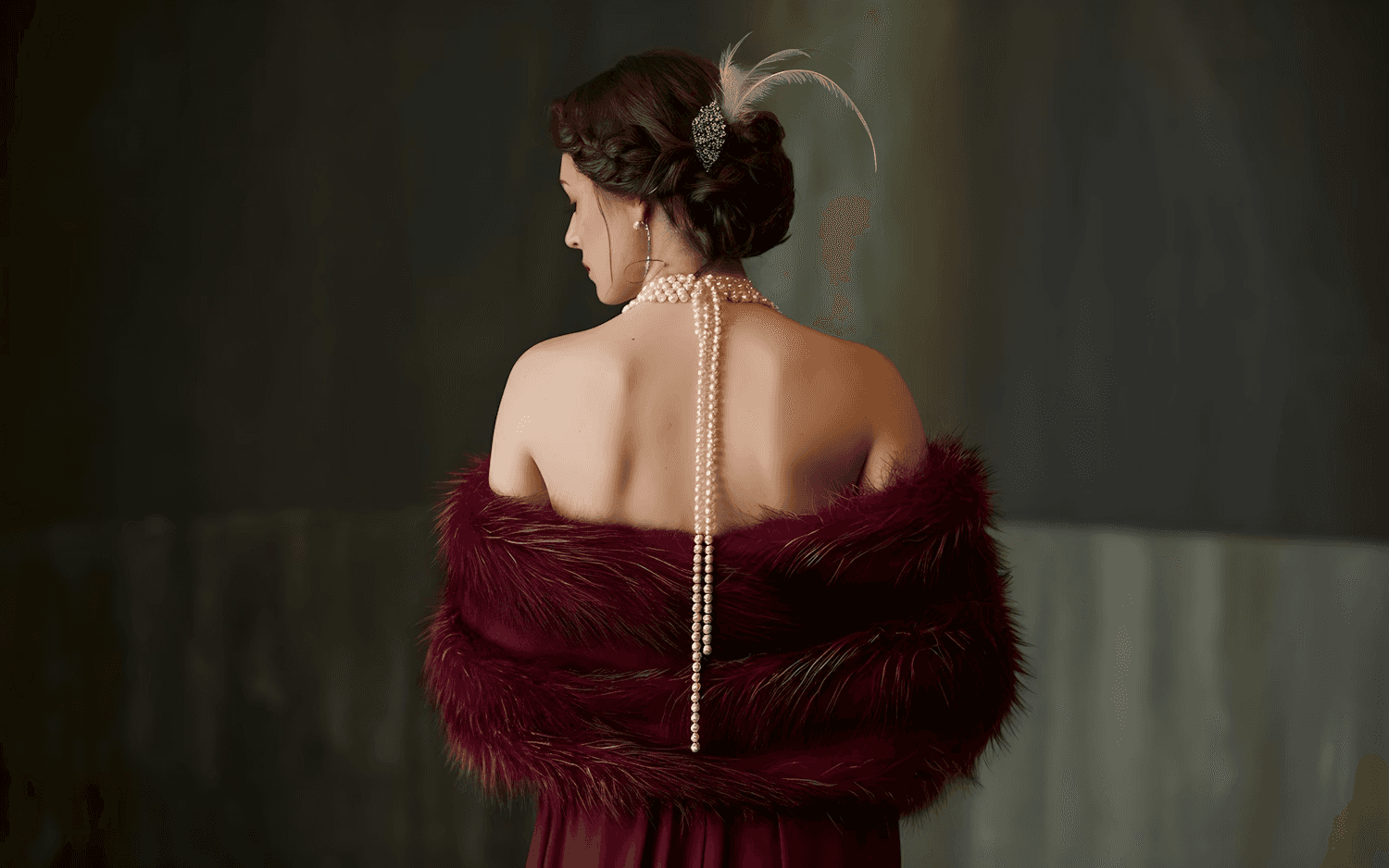 Elegant woman in burgundy fur stole and pearls