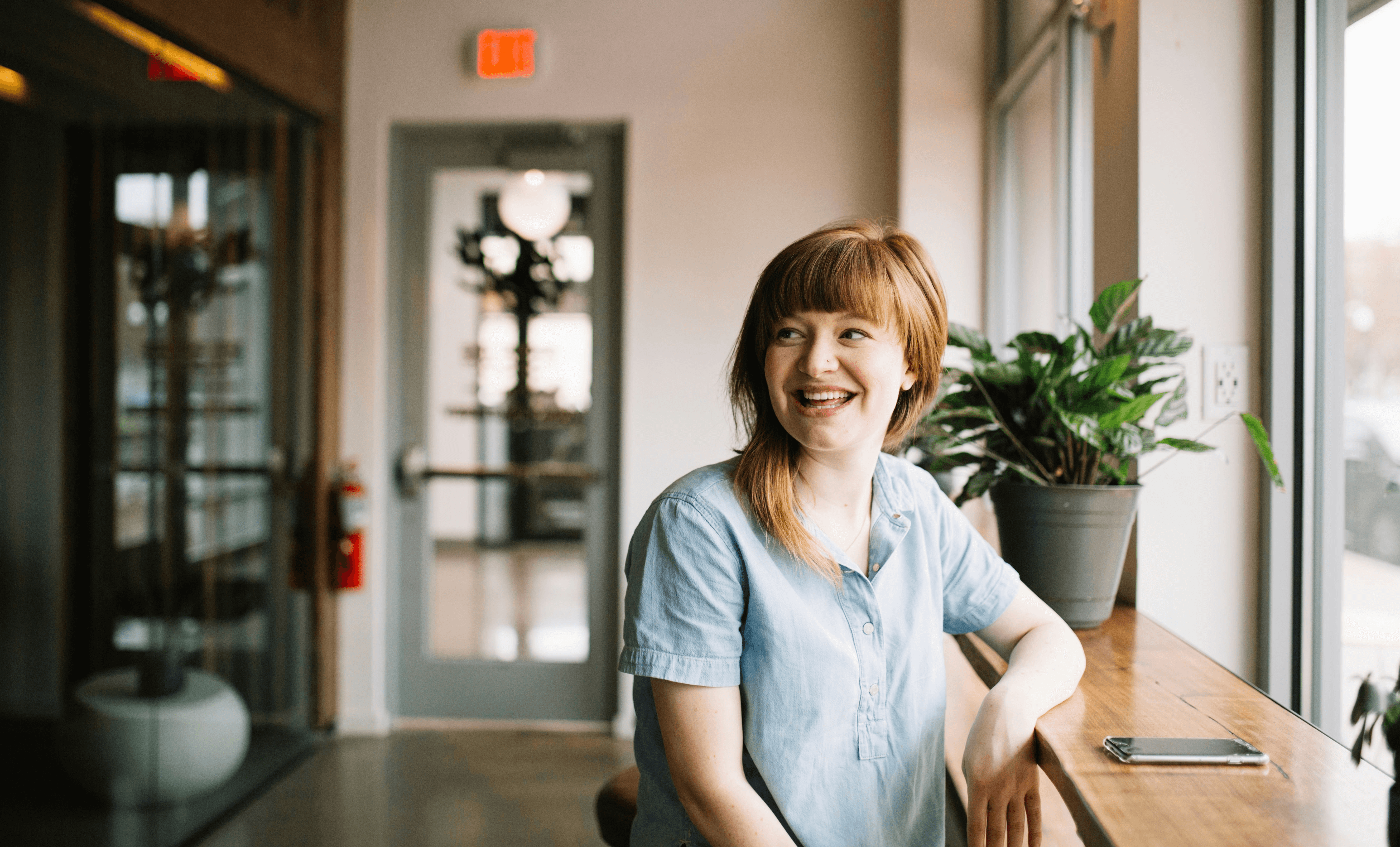 a woman holding a stethoscope in her right hand