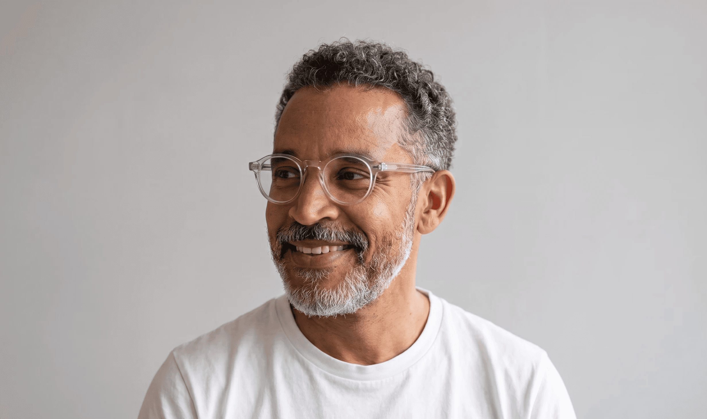 Portrait of Marcus Feld, Co-Founder and CTO, smiling with short greying hair