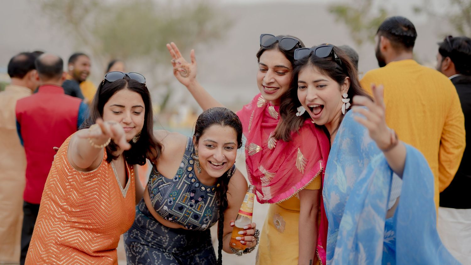 wedding guests dancing candid celebration haldi event friends joyful moment
