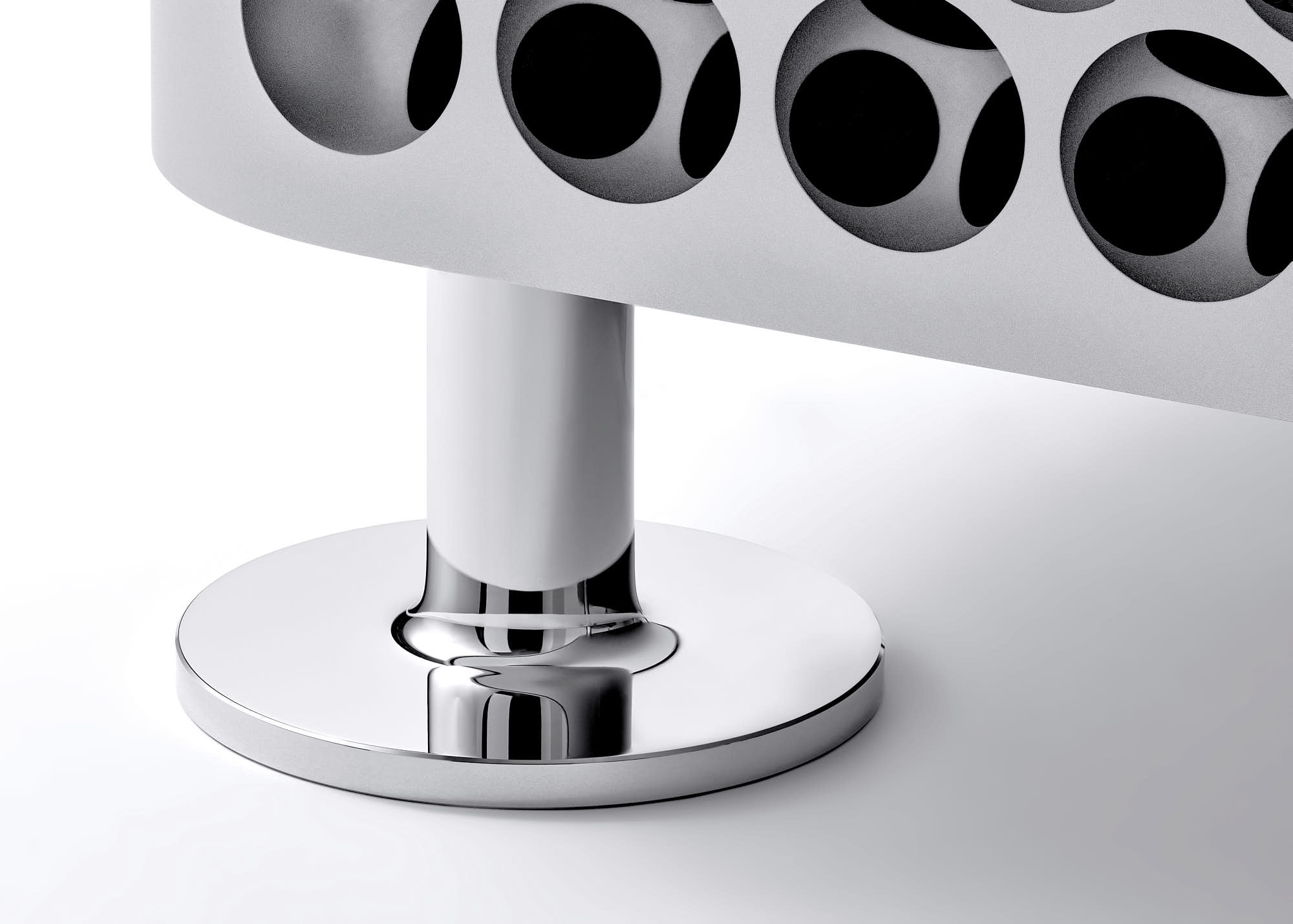 Modern chrome furniture leg with sleek metal base design.