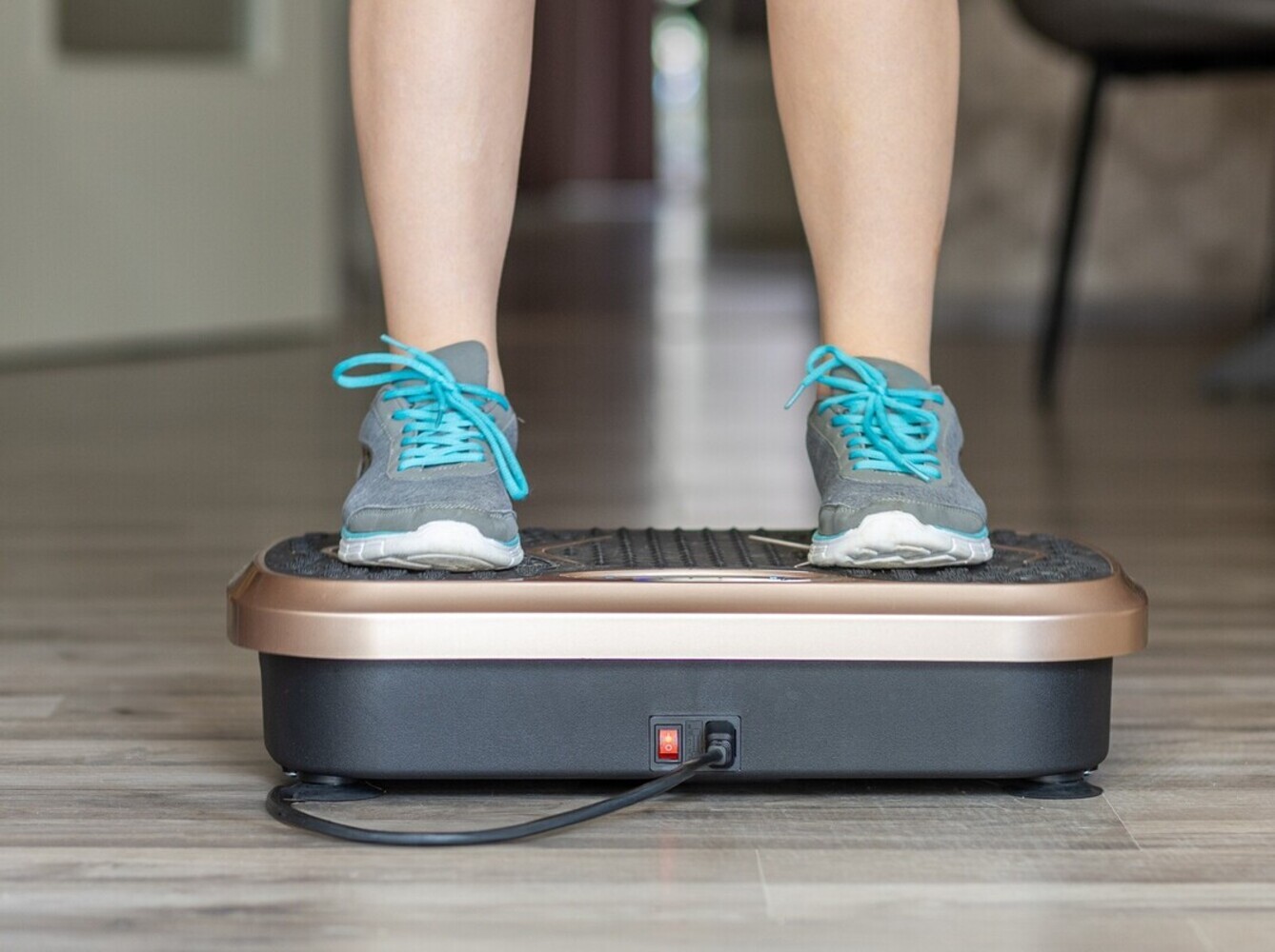 person standing on a shake machine for weight loss