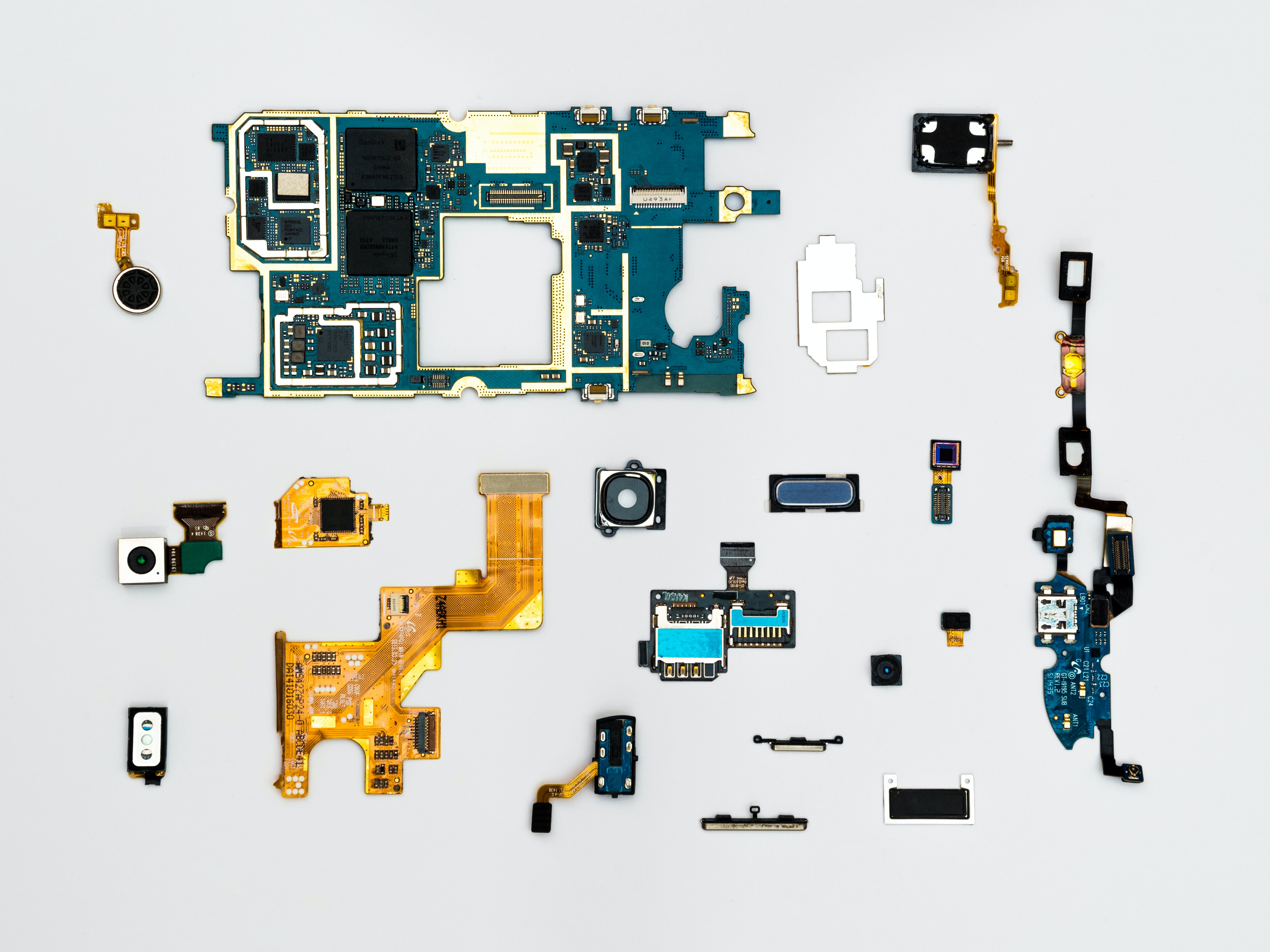 parts of a mobile phone arranged on a table