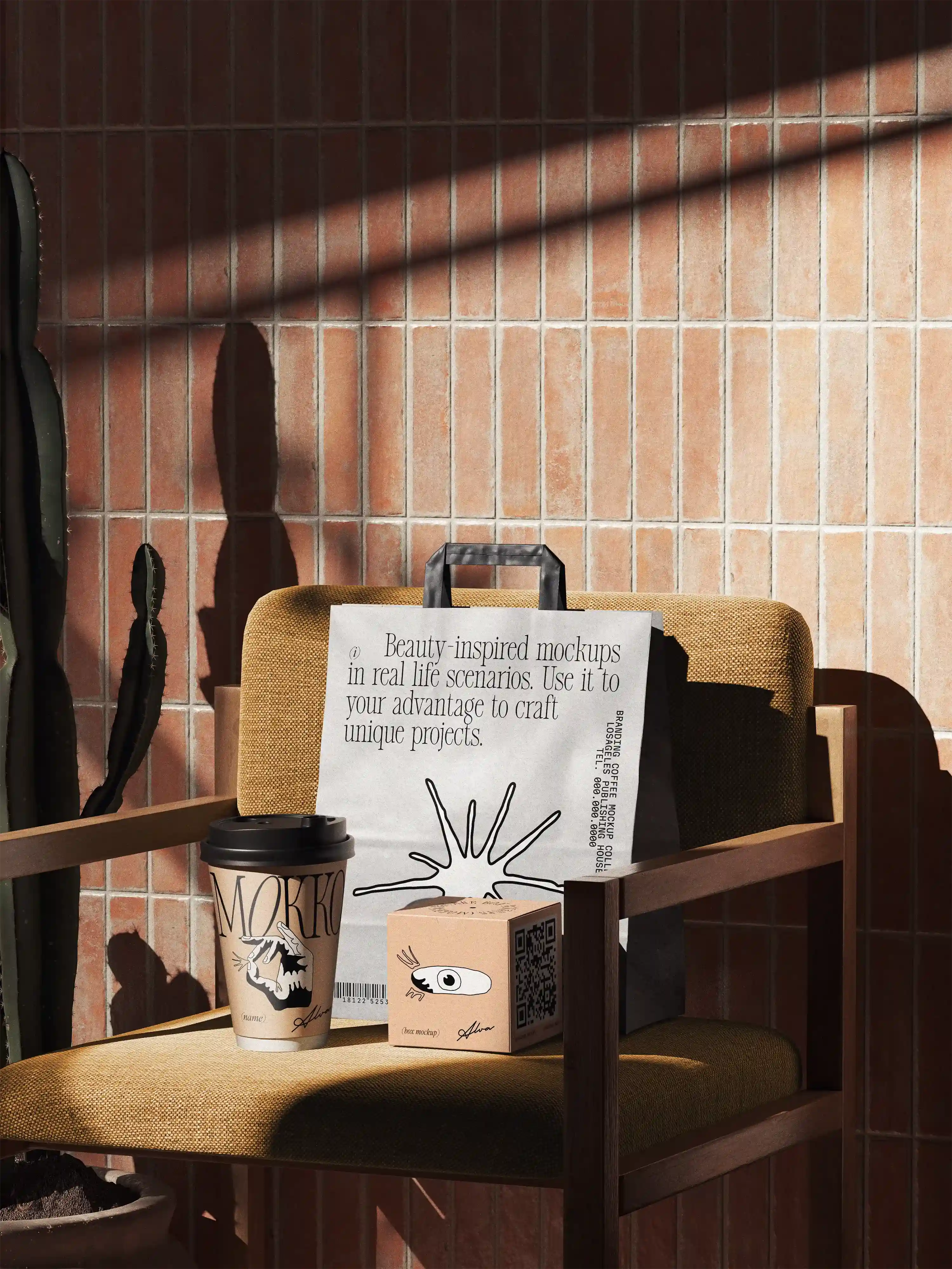 Full set of Mokko branded paper packaging and cups on tiled ledge under sunlight