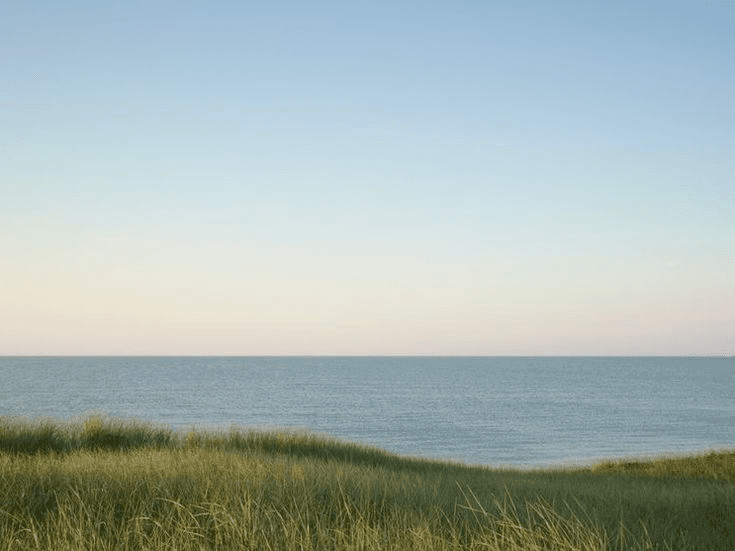 the eiffel tower is lit up at night