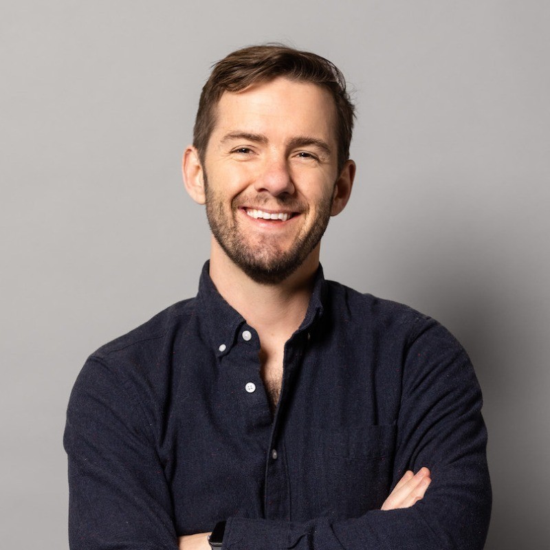 a man with a dark background