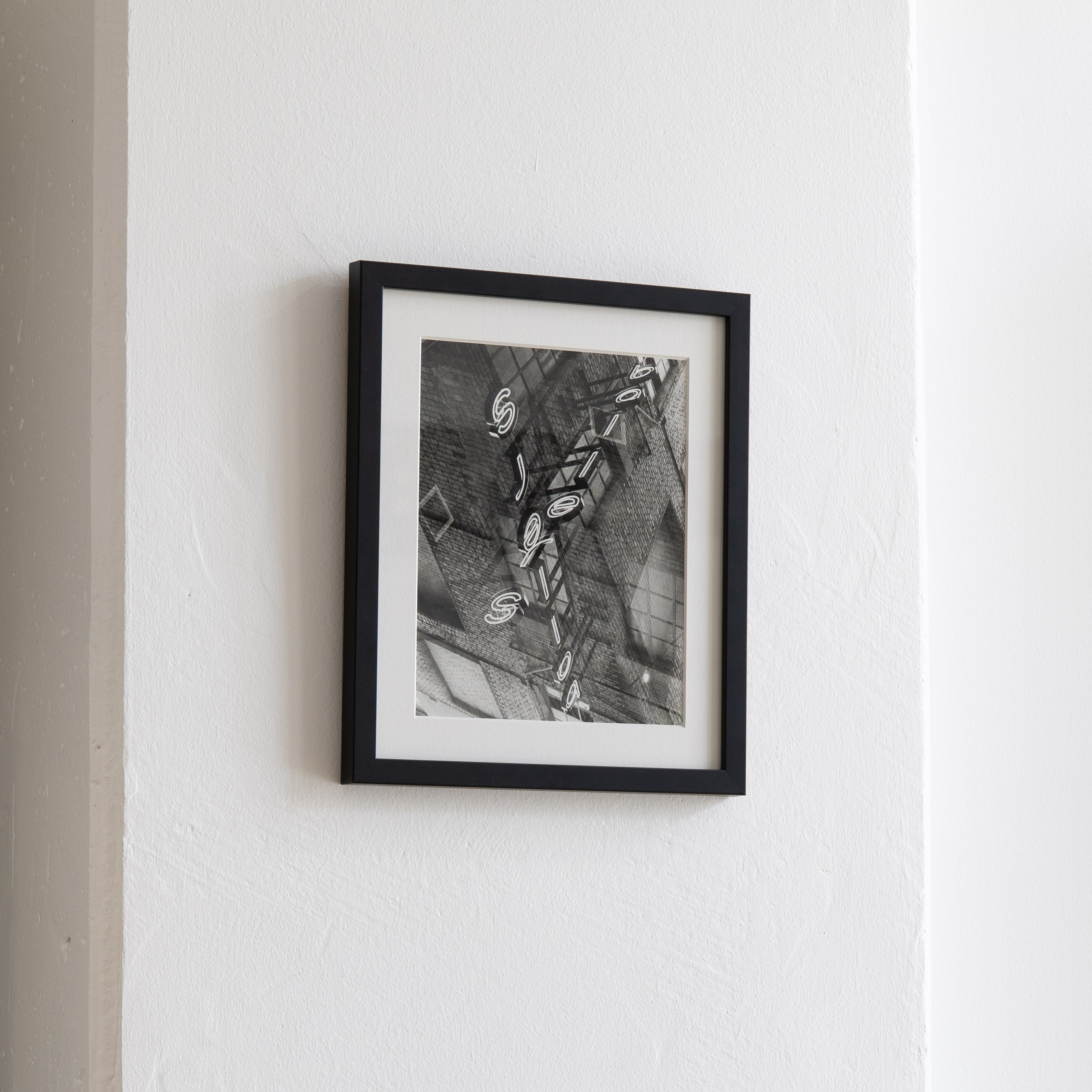 Darkroom prints drying on wire racks
