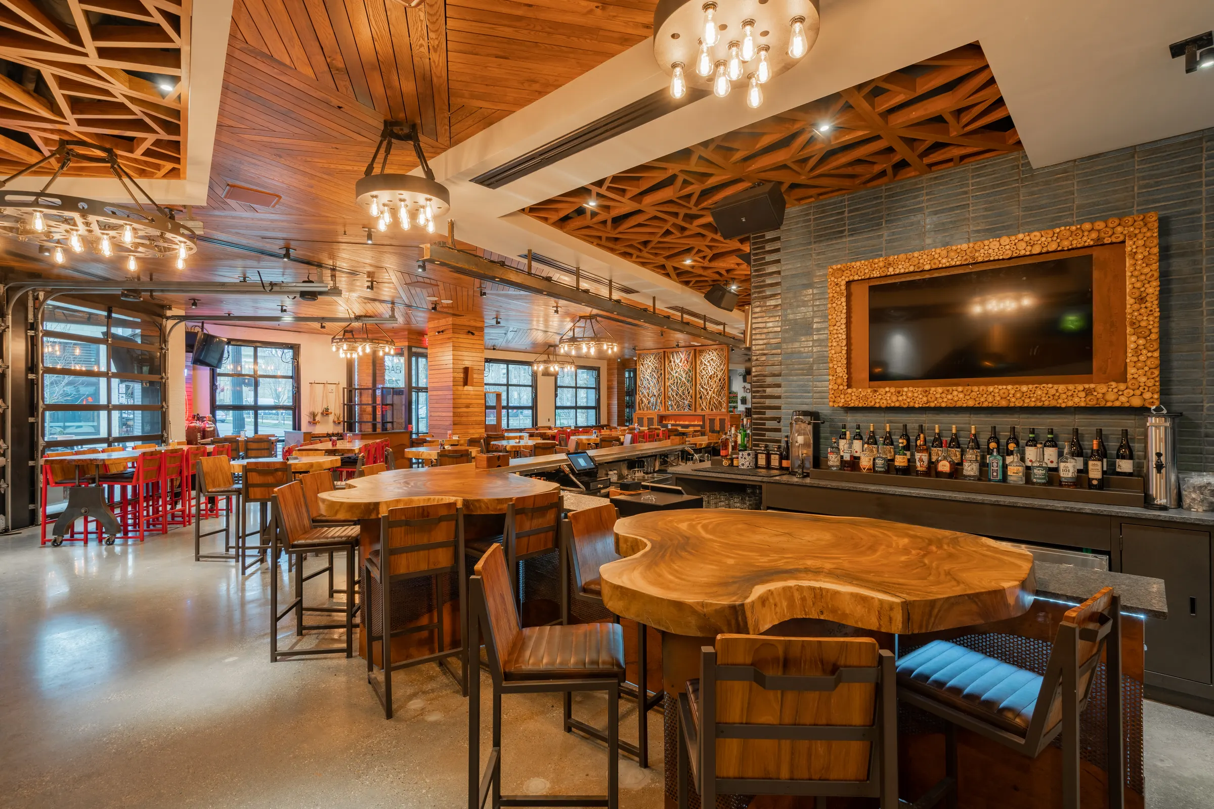 Bar and high-top tables under a wood lattice ceiling at TownHall Columbus