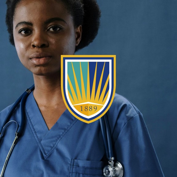 Young woman in blue scrubs with a stethoscope around her neck, standing against a blue background. A colorful crest with "1889" overlays the image.