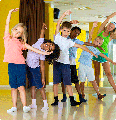 Students practicing classical ballet technique and posture in structured after school dance program
