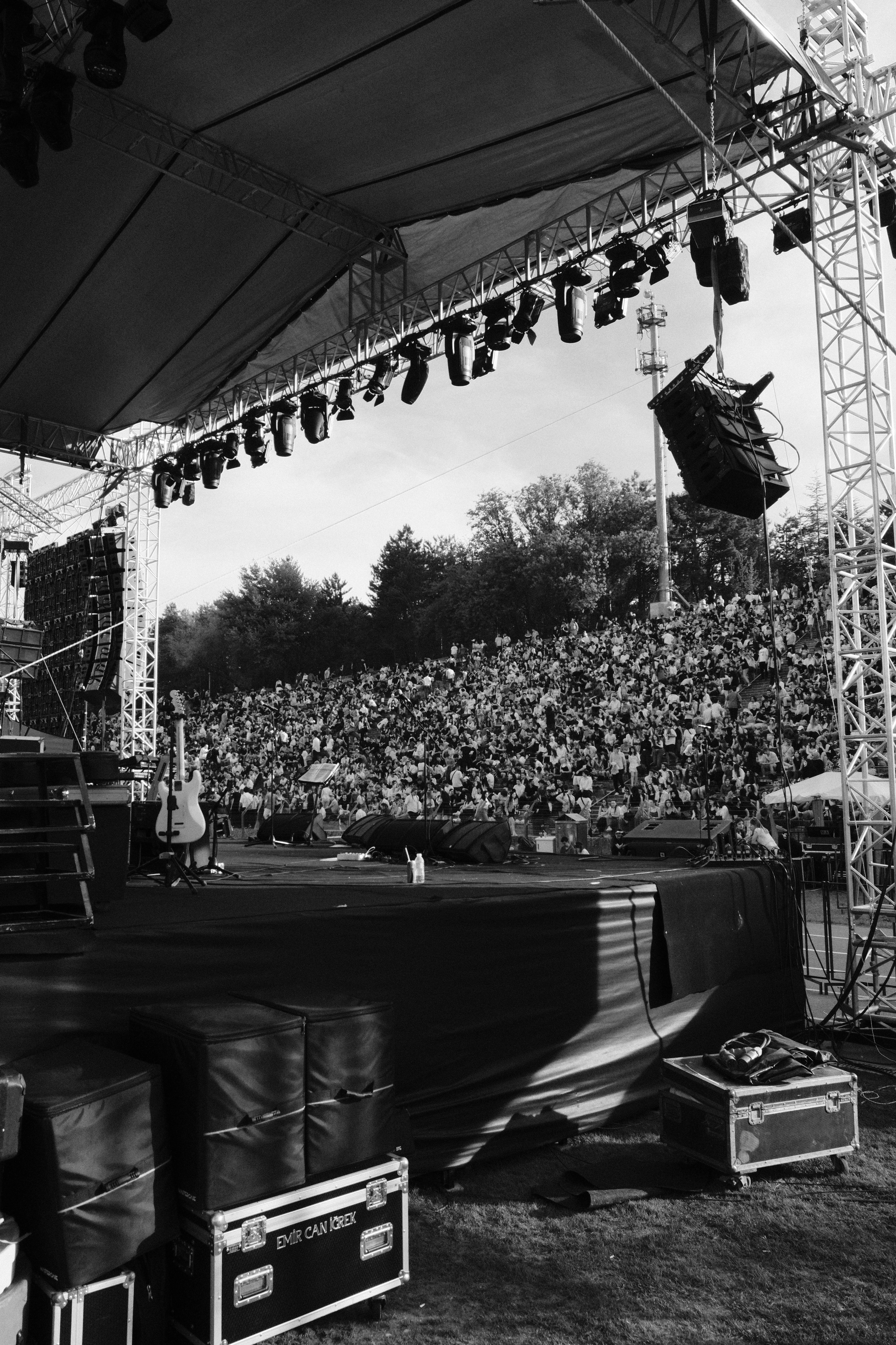 A concert stage faces a huge, packed audience.