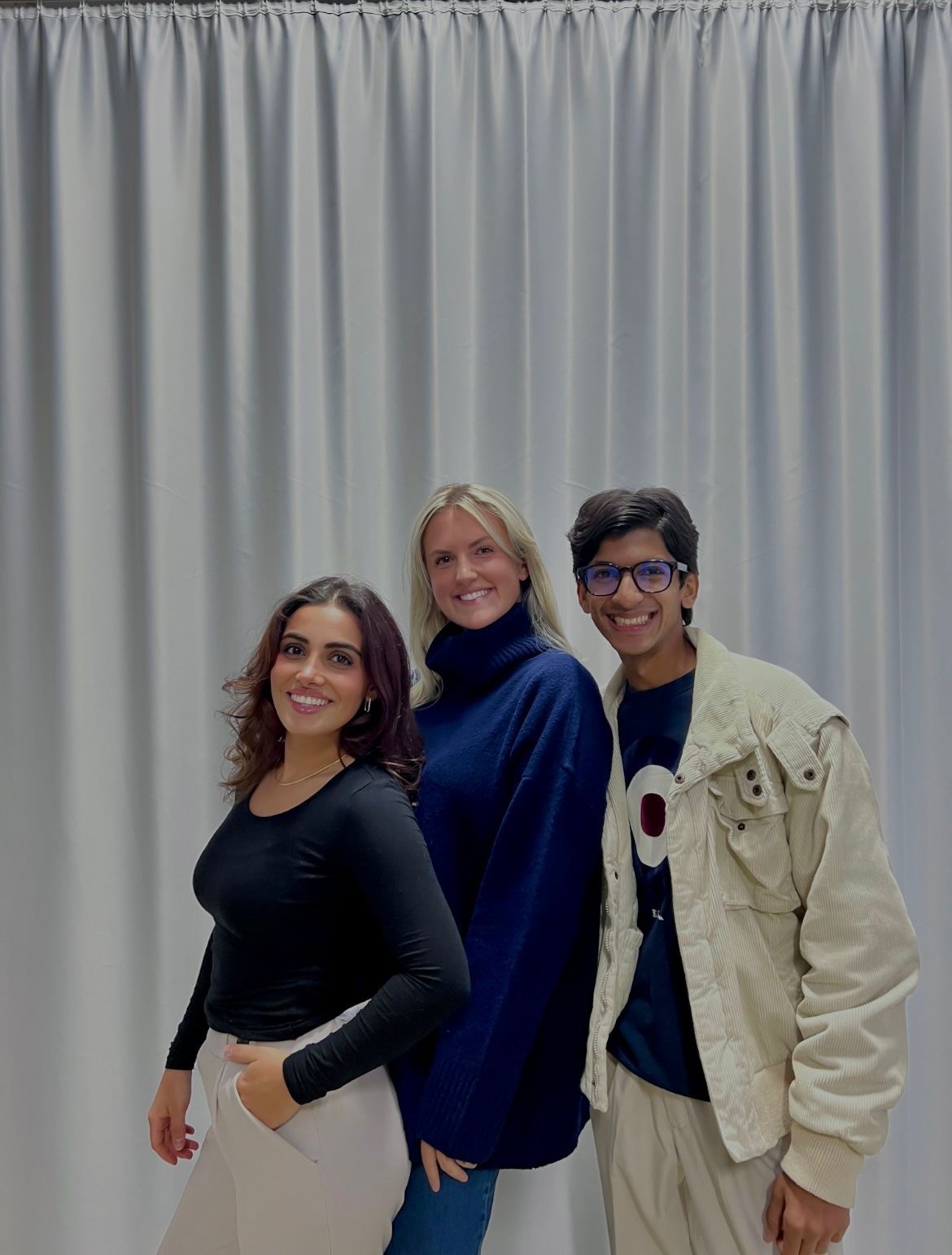 People playing soccer on a rooftop court surrounded by city buildings