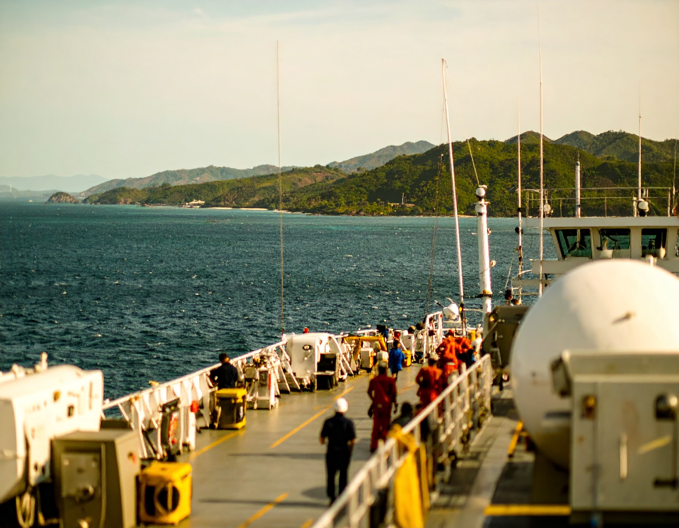 on deck of a ship with crew and devices aboard