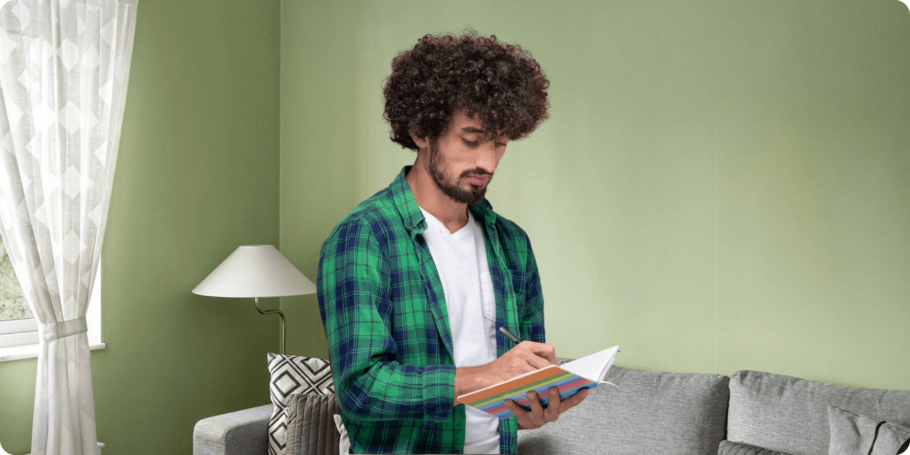 person writing on white paper