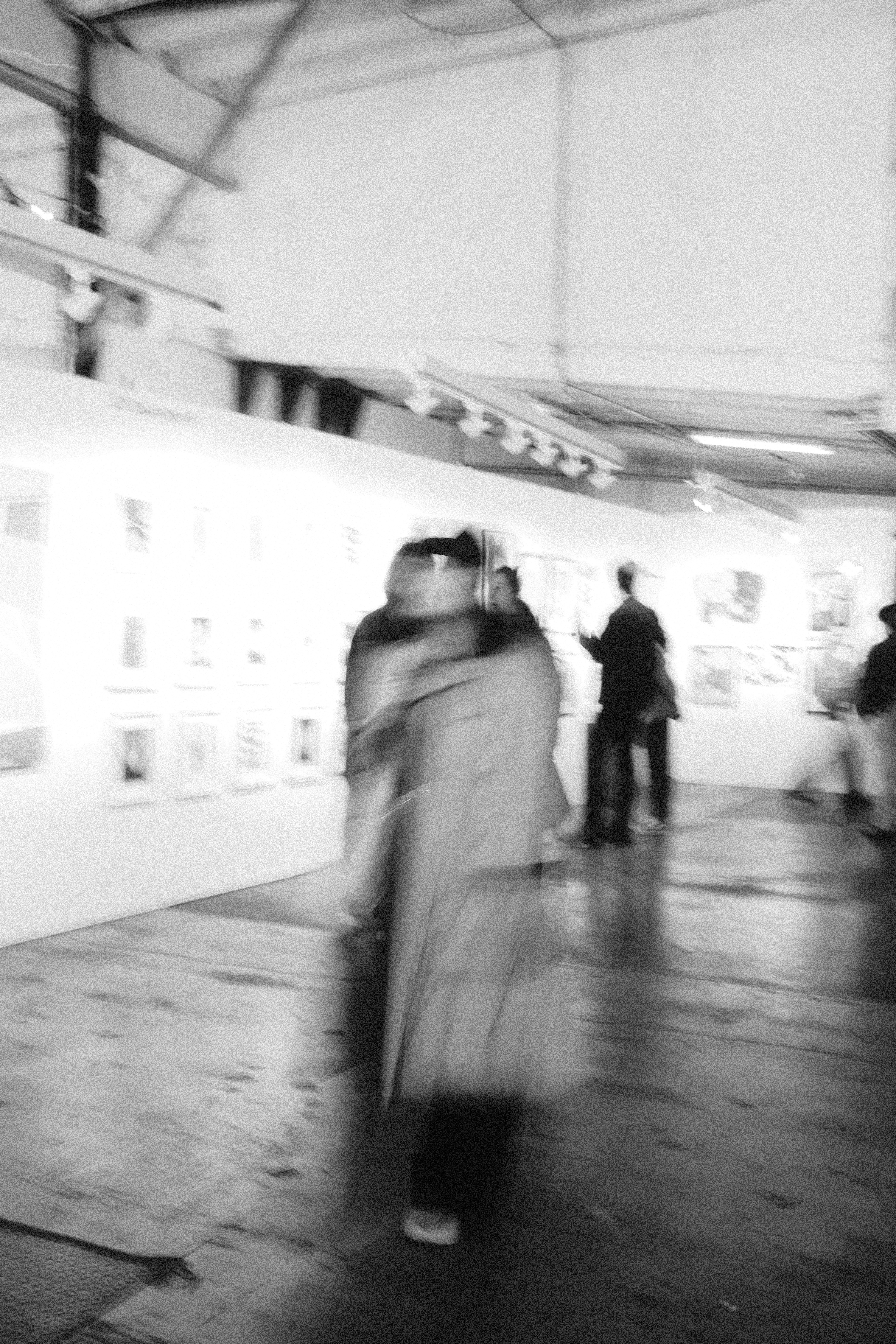 Person walking in art gallery