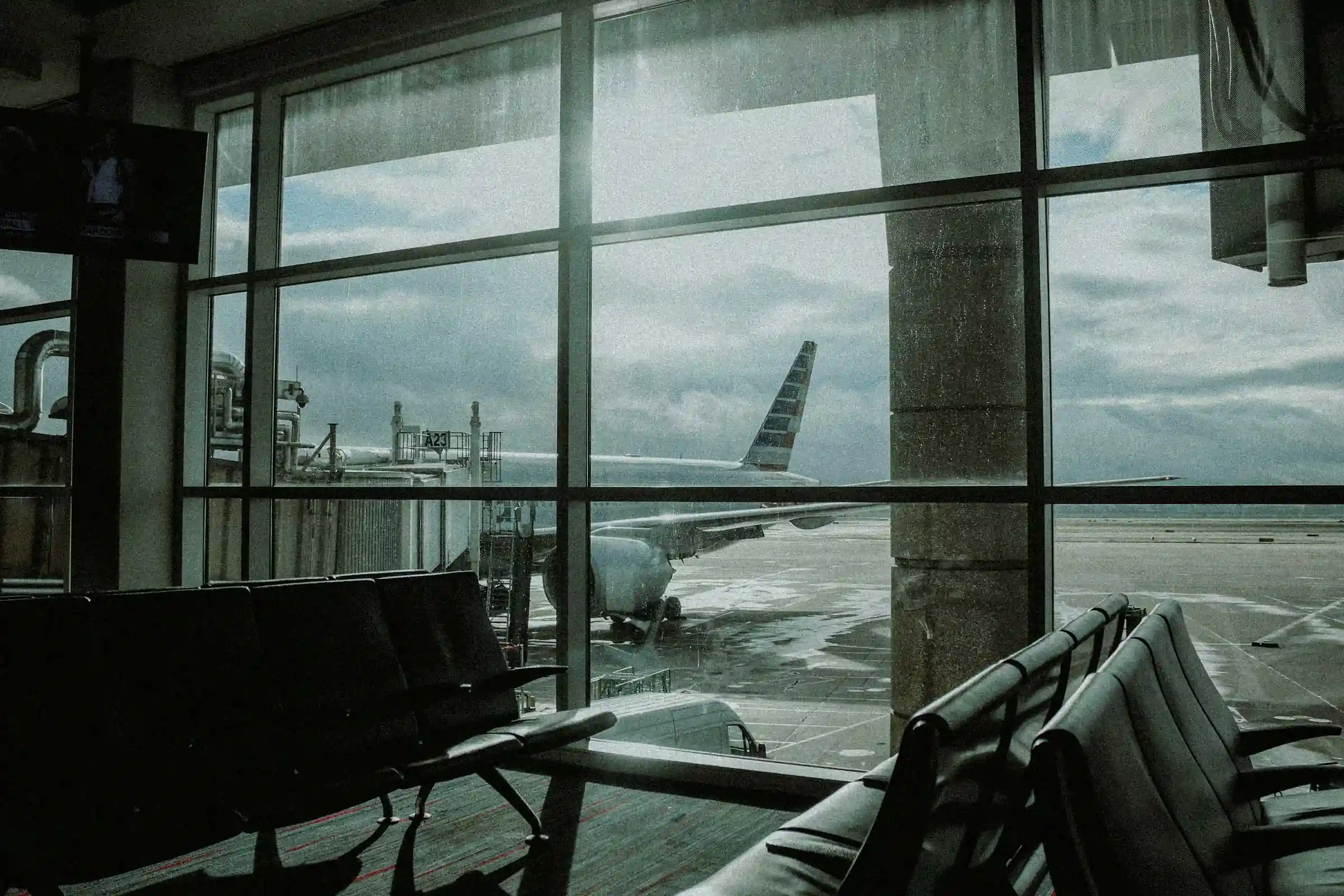 Airplane at gate through airport window