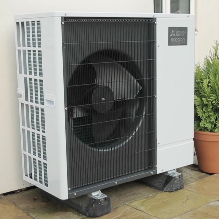 a wall mounted air conditioner mounted on the side of a building